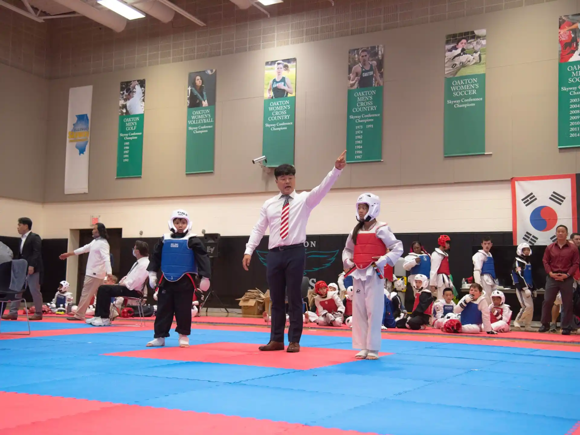 a person standing on a mat with a group of people in clothing