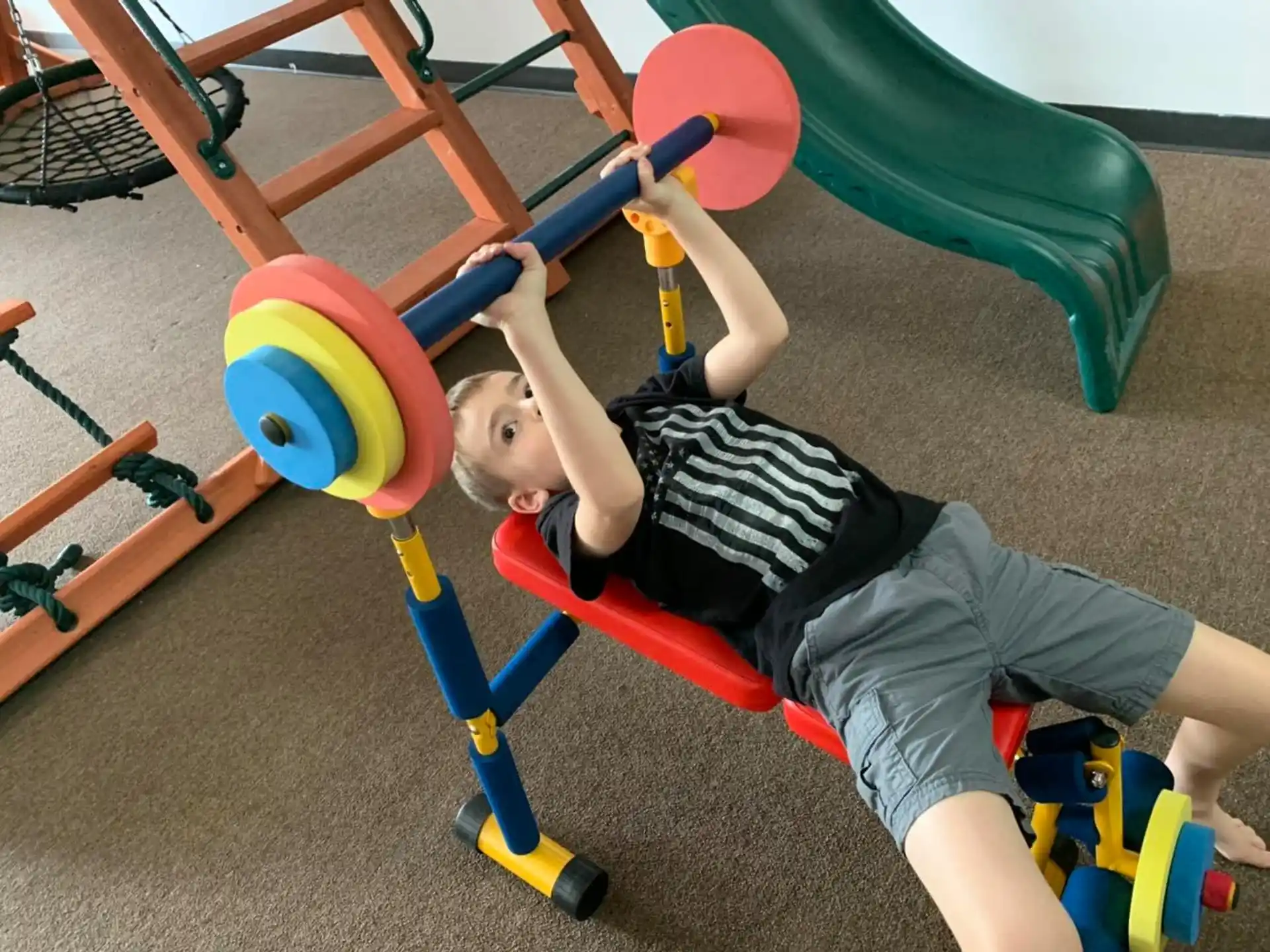 a baby playing on a toy