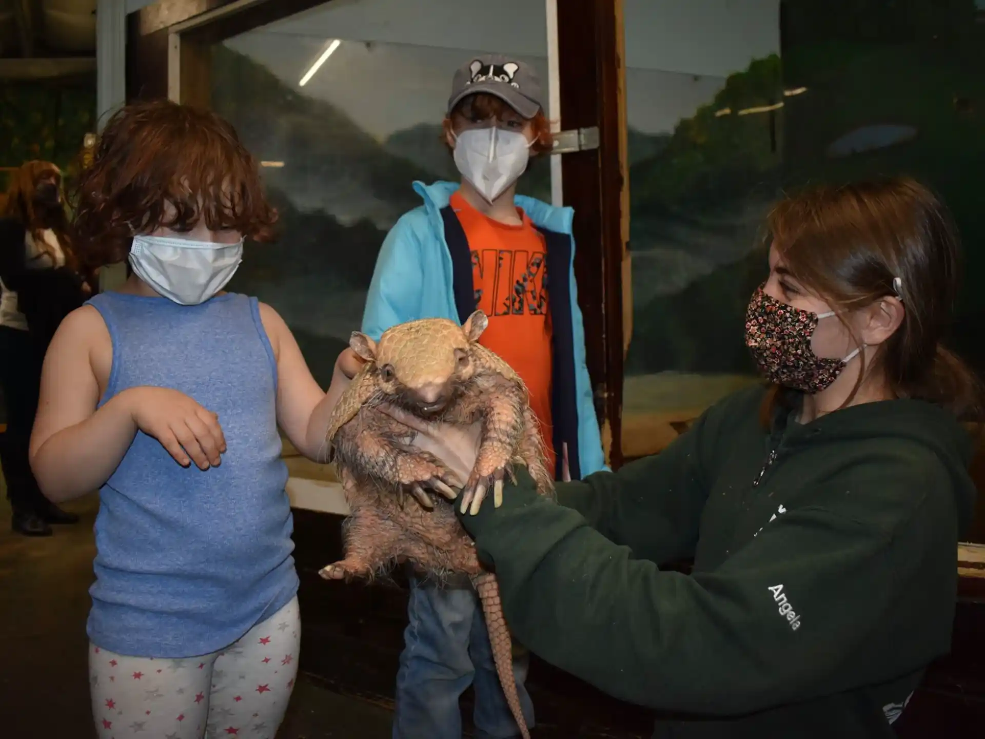 a woman holding a stuffed animal