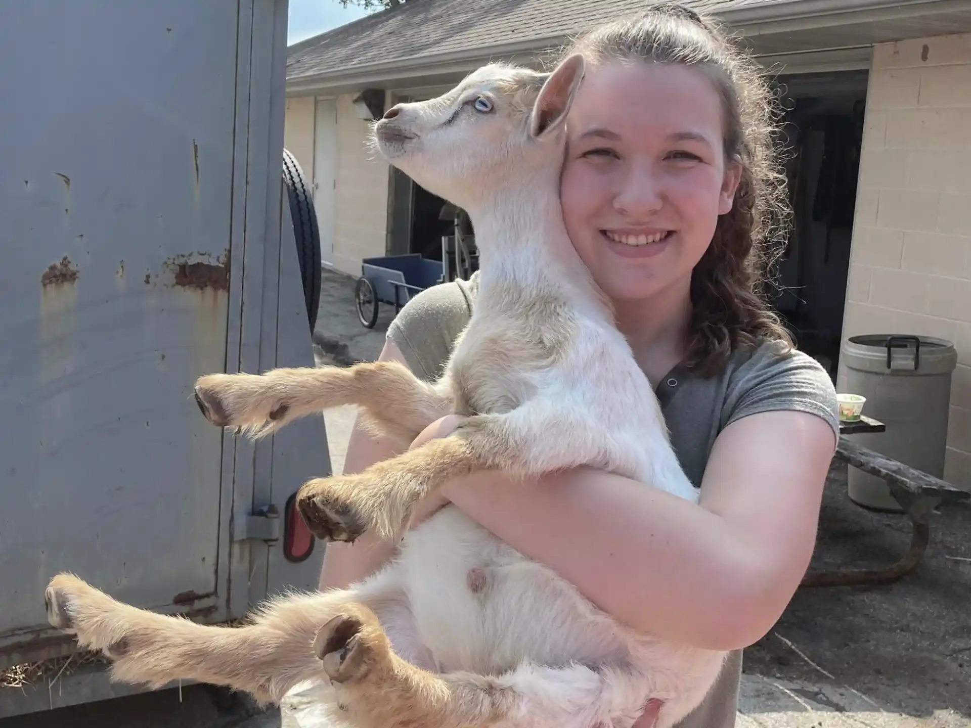 a woman holding a dog