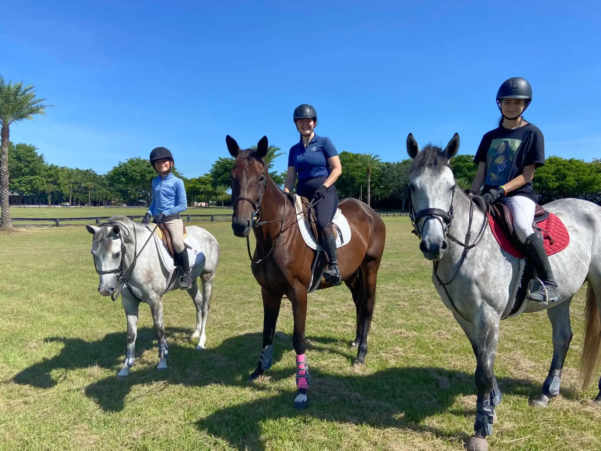 a group of people riding horses