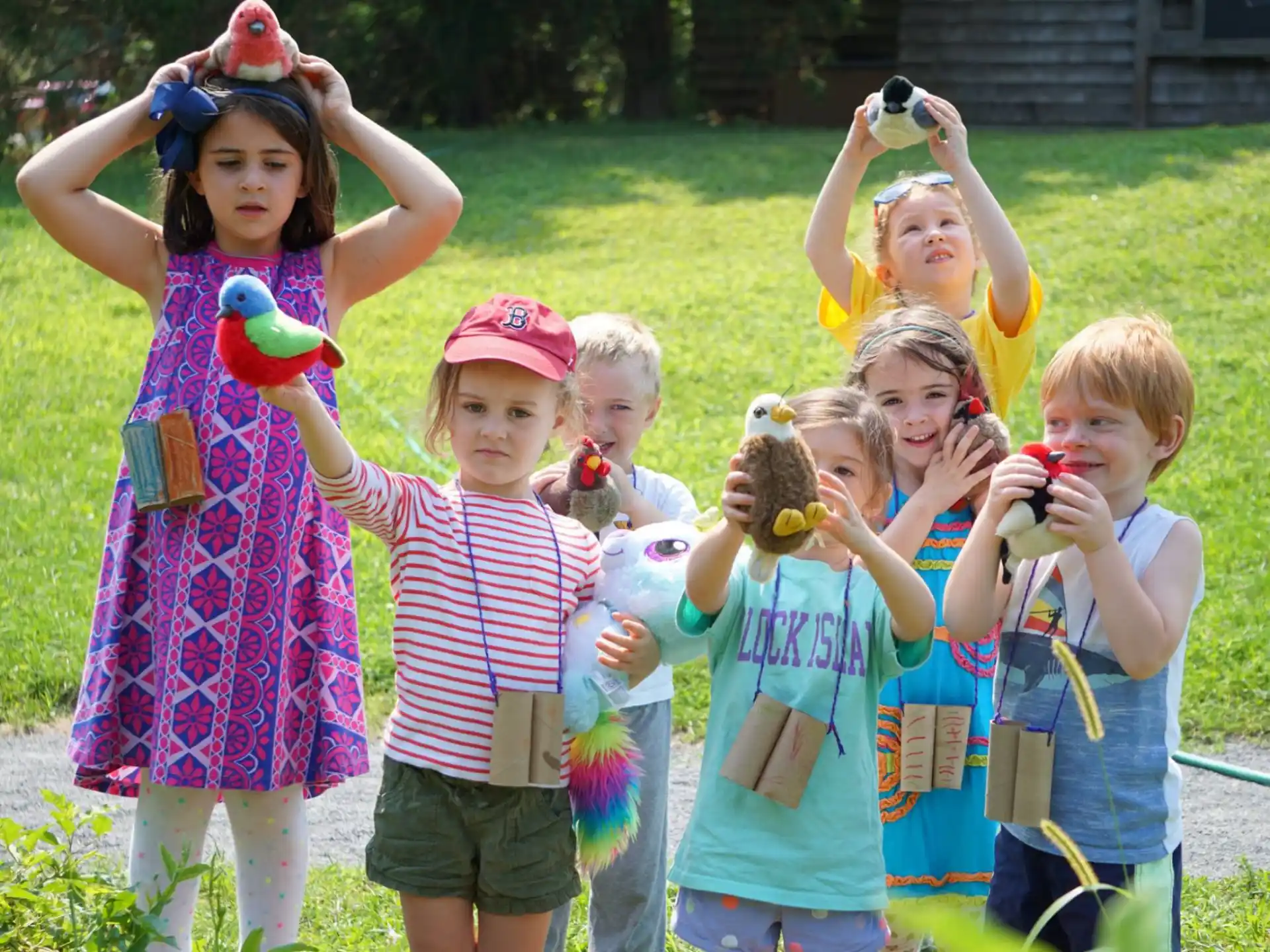 a group of children holding toys
