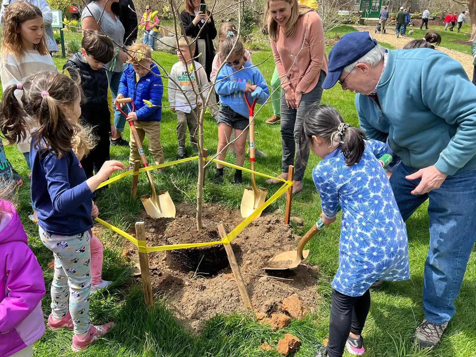 a group of people working on a garden