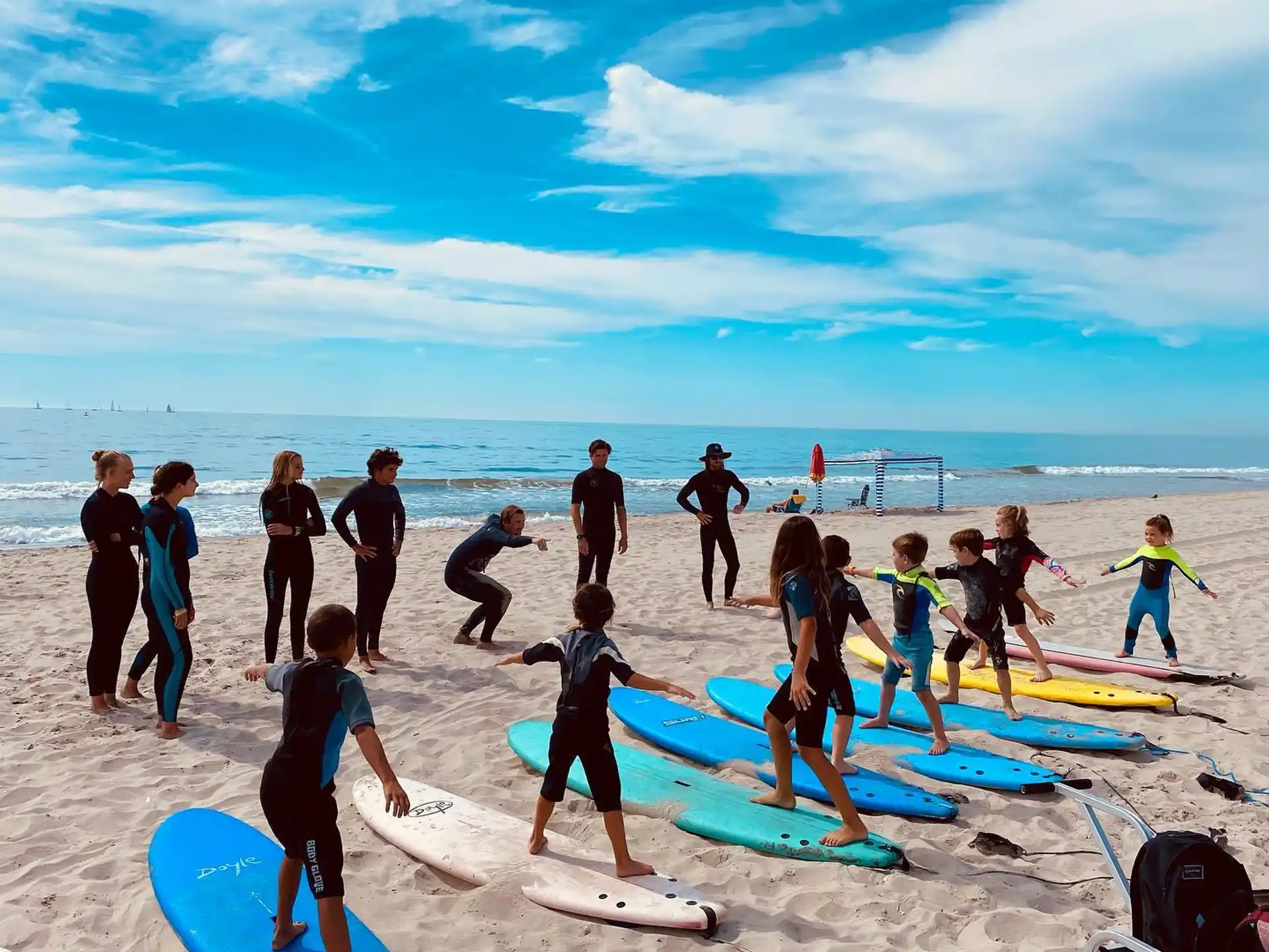 a group of people stand on a beach