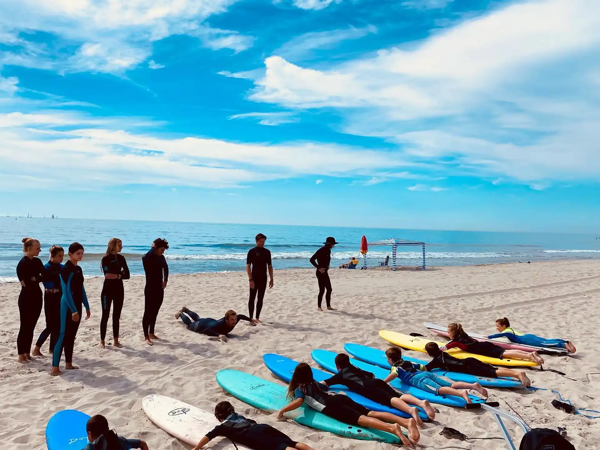 a group of people stand on a beach