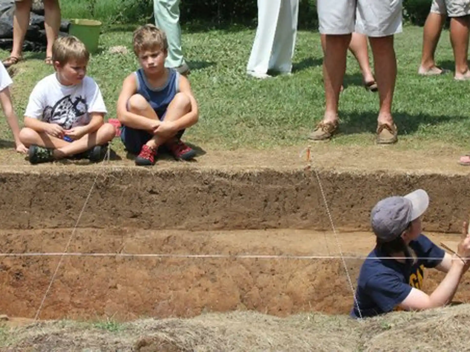 a group of children playing in the dirt