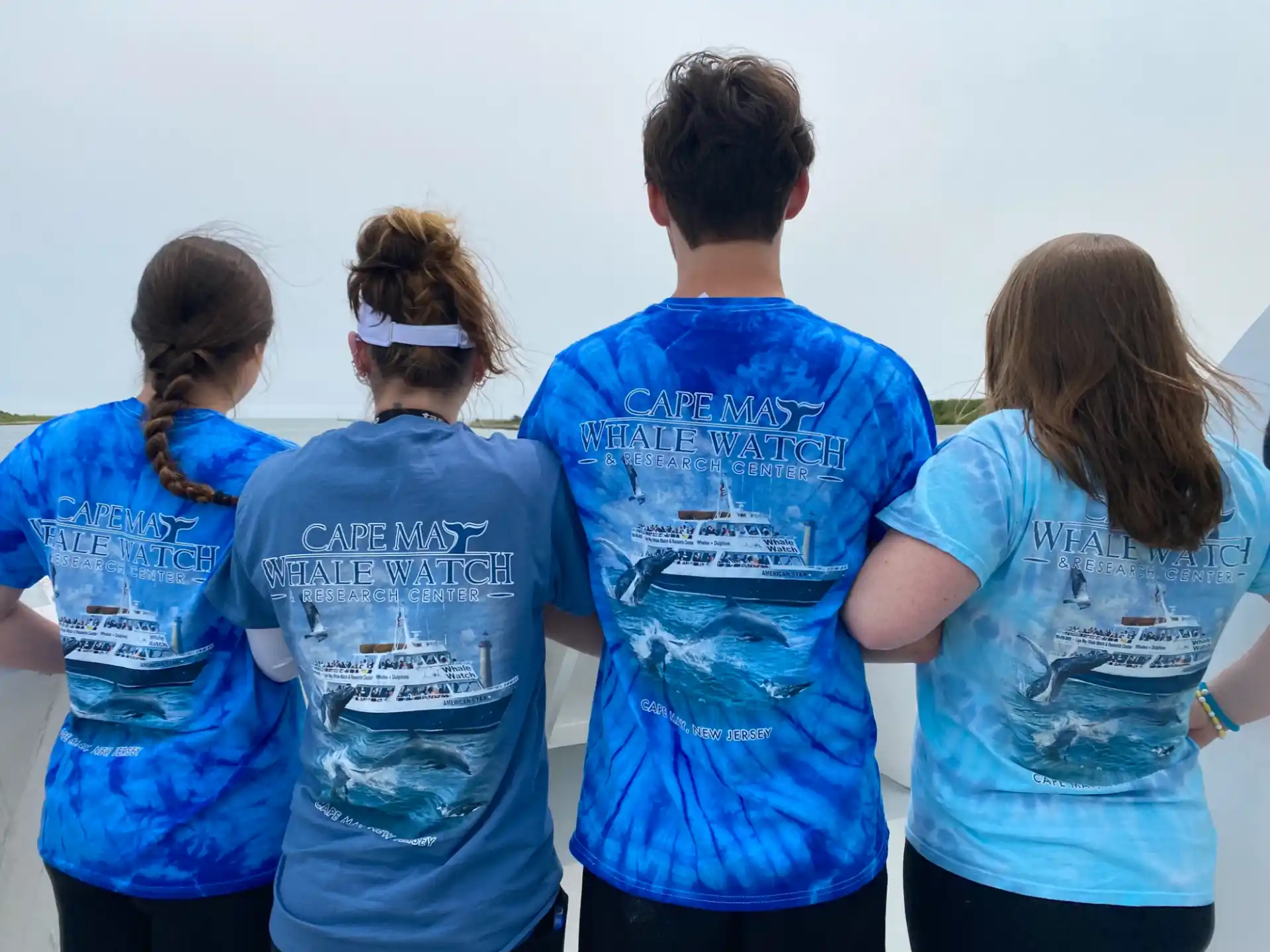 a group of people wearing blue shirts