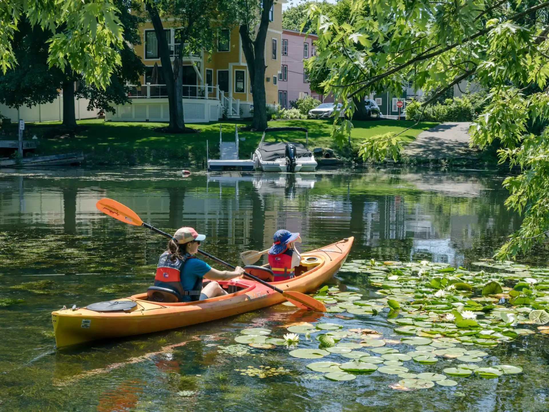 a group of people in a canoe on a river