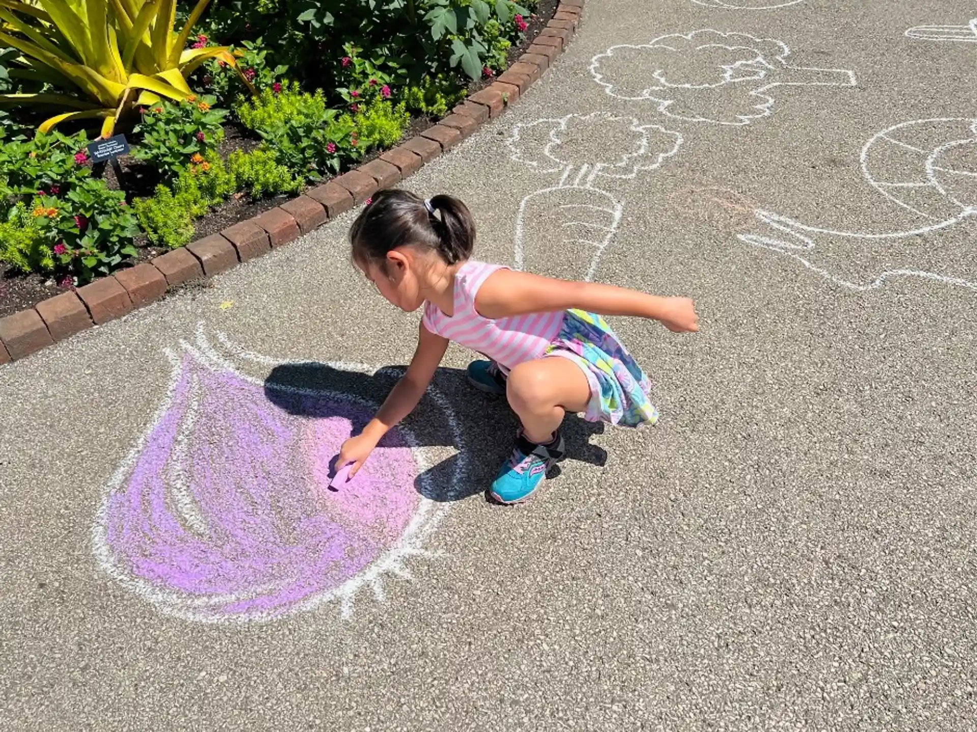 a girl playing in the street