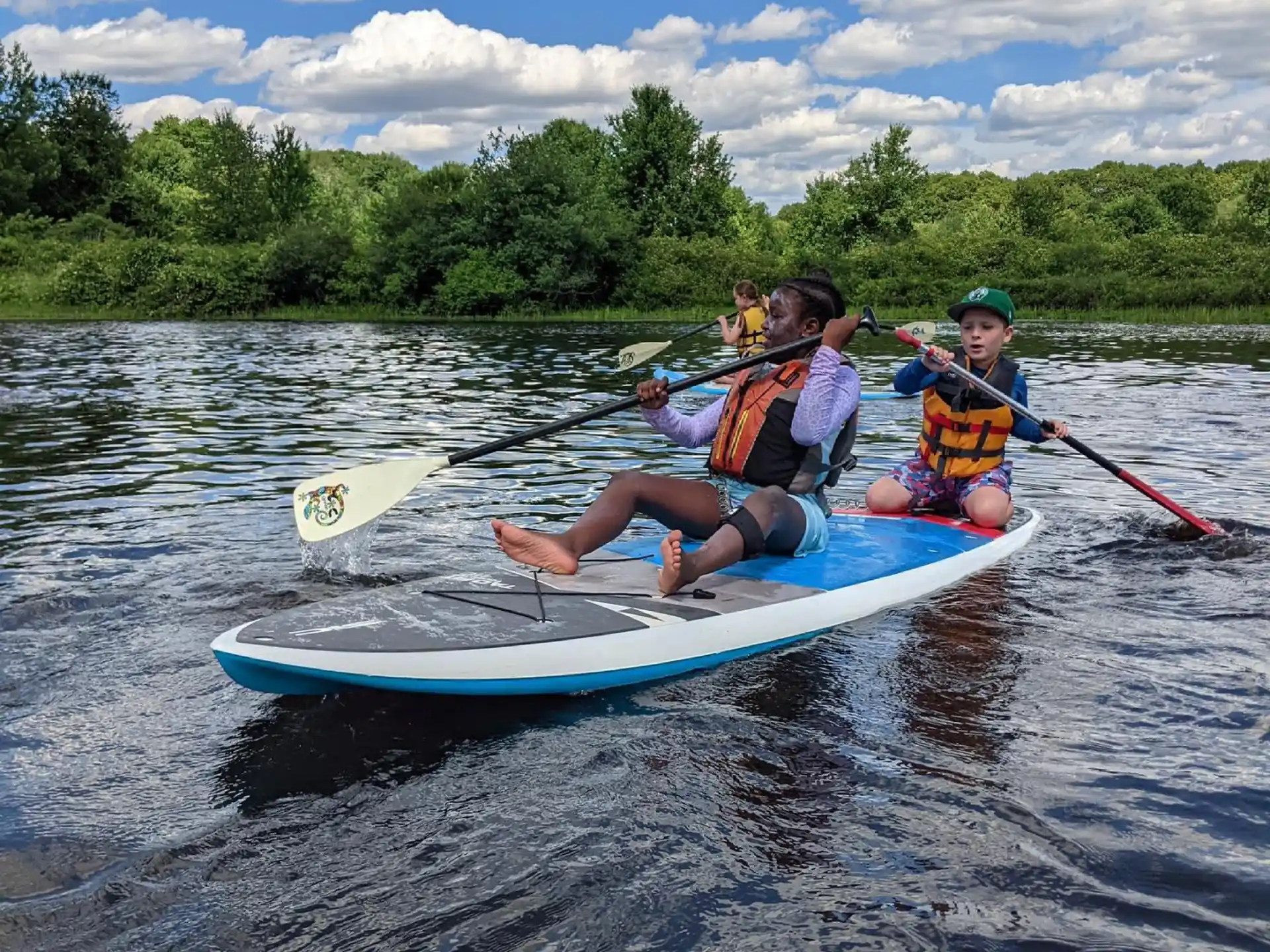 a group of people in a canoe