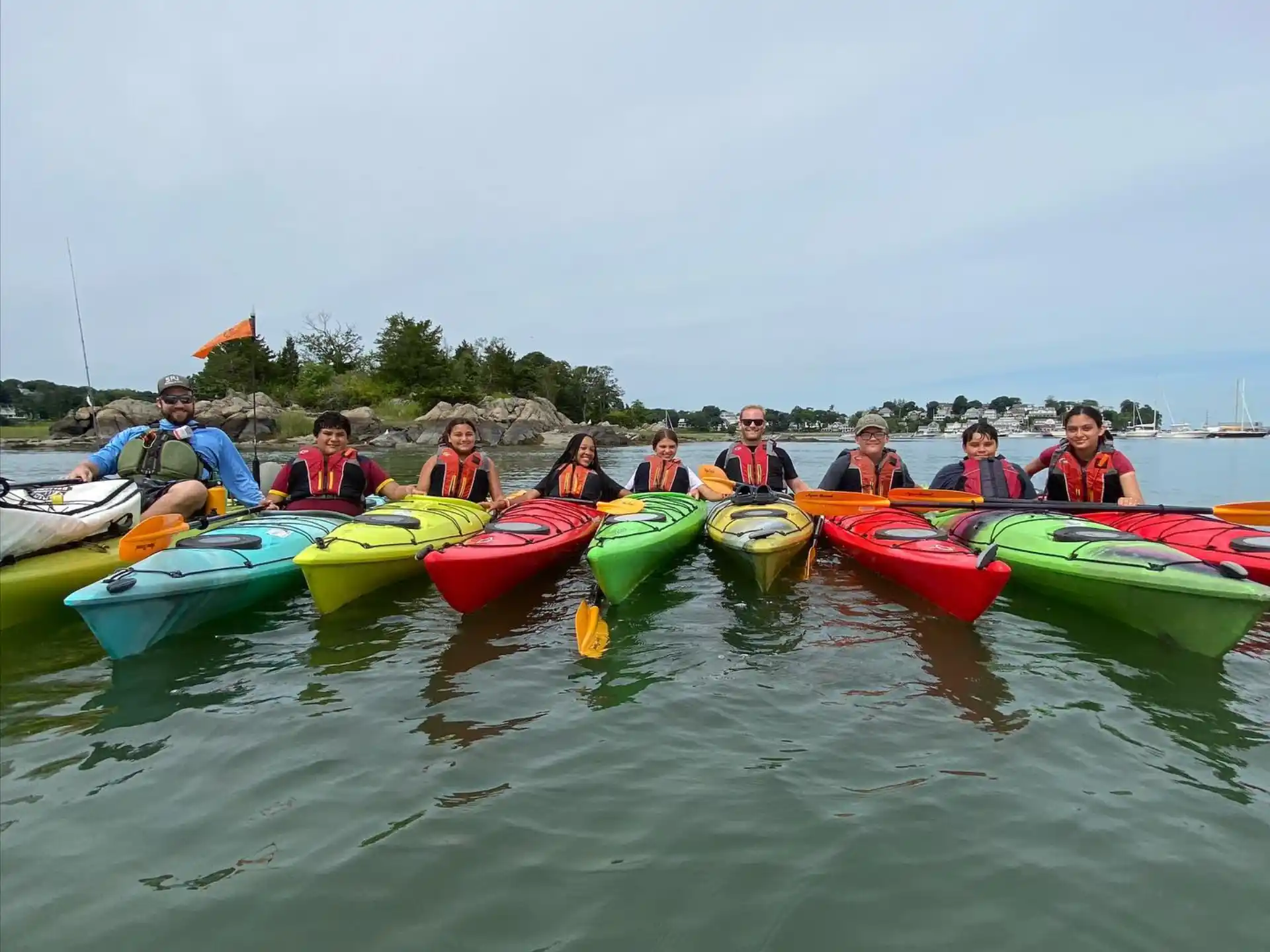 a group of people in kayaks