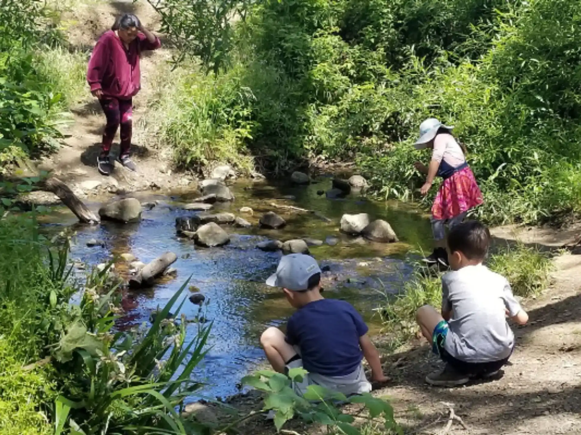 a group of people by a river