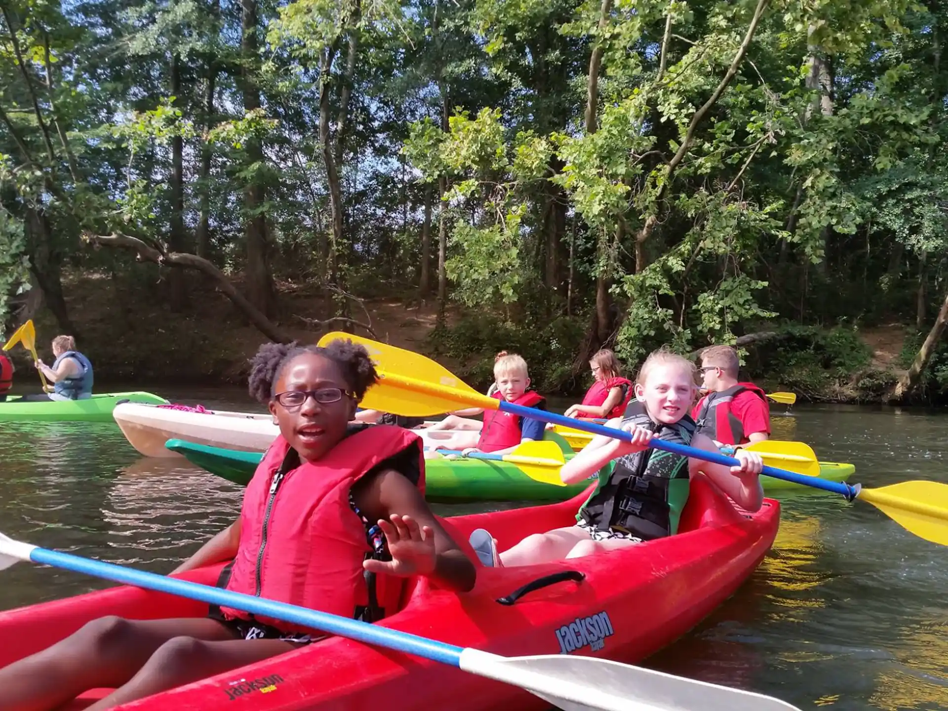 a group of people in kayaks