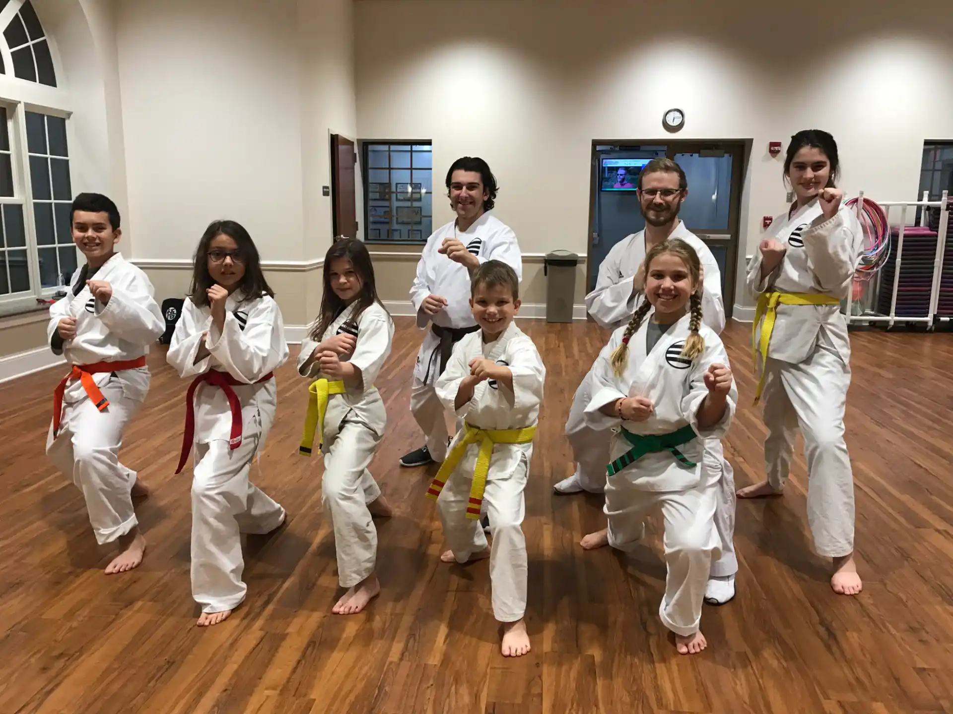 a group of people in karate uniforms