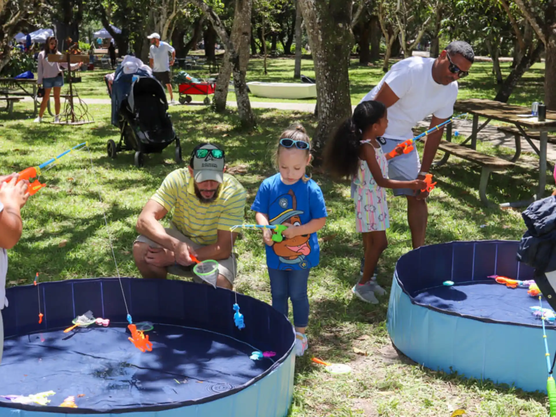 a group of people playing with toys