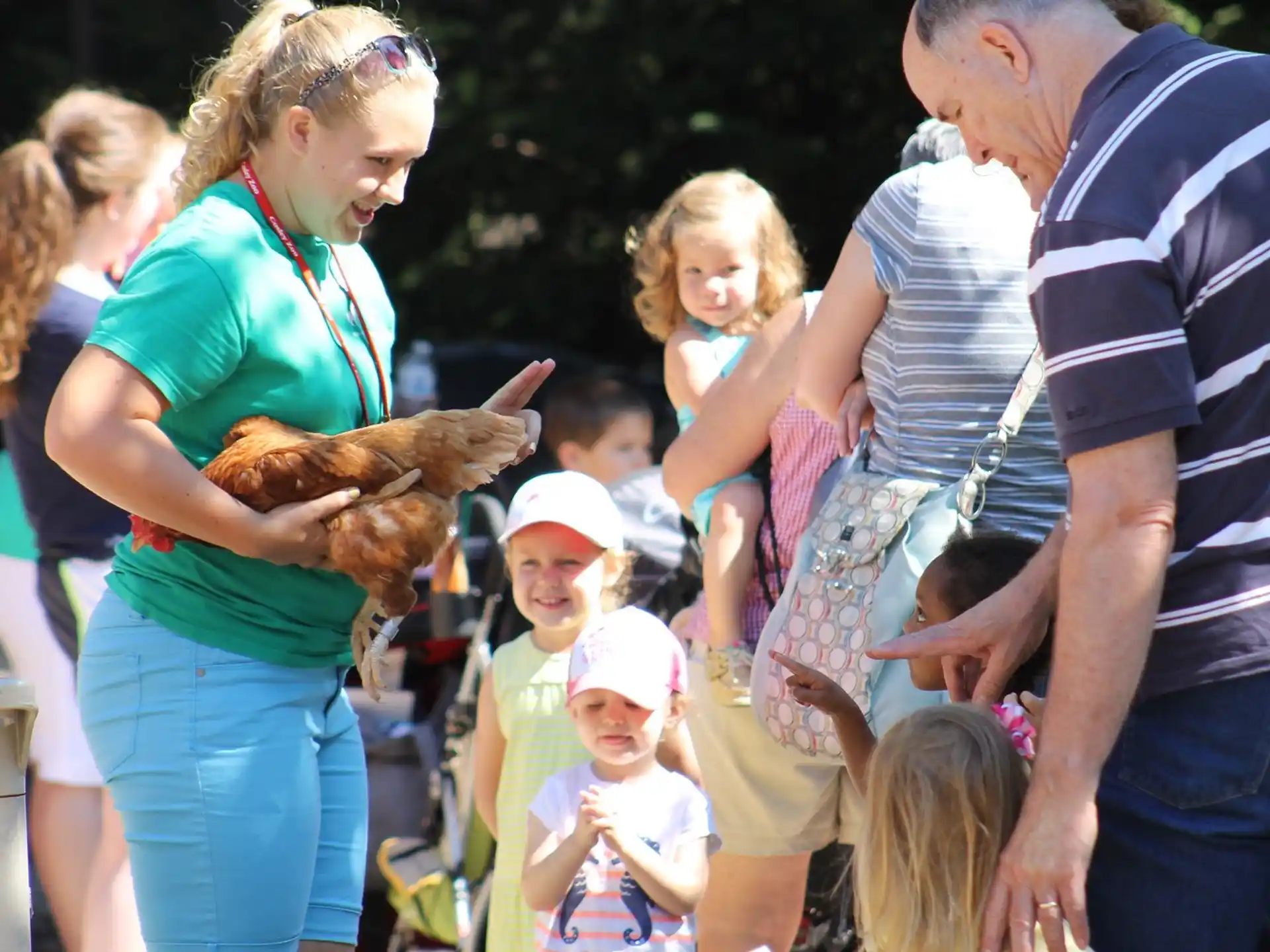 a group of people holding a bird