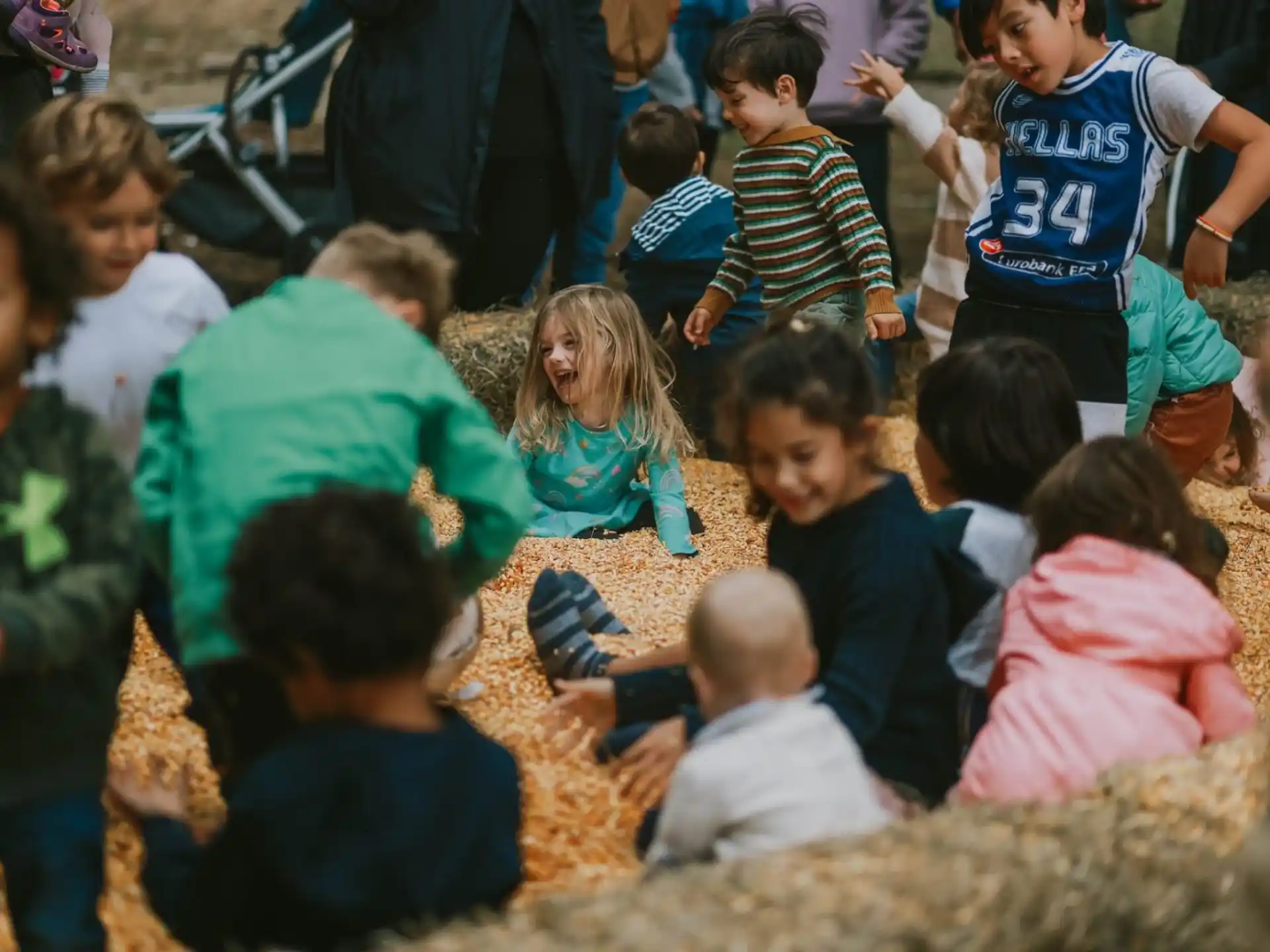 a group of children sitting on the ground