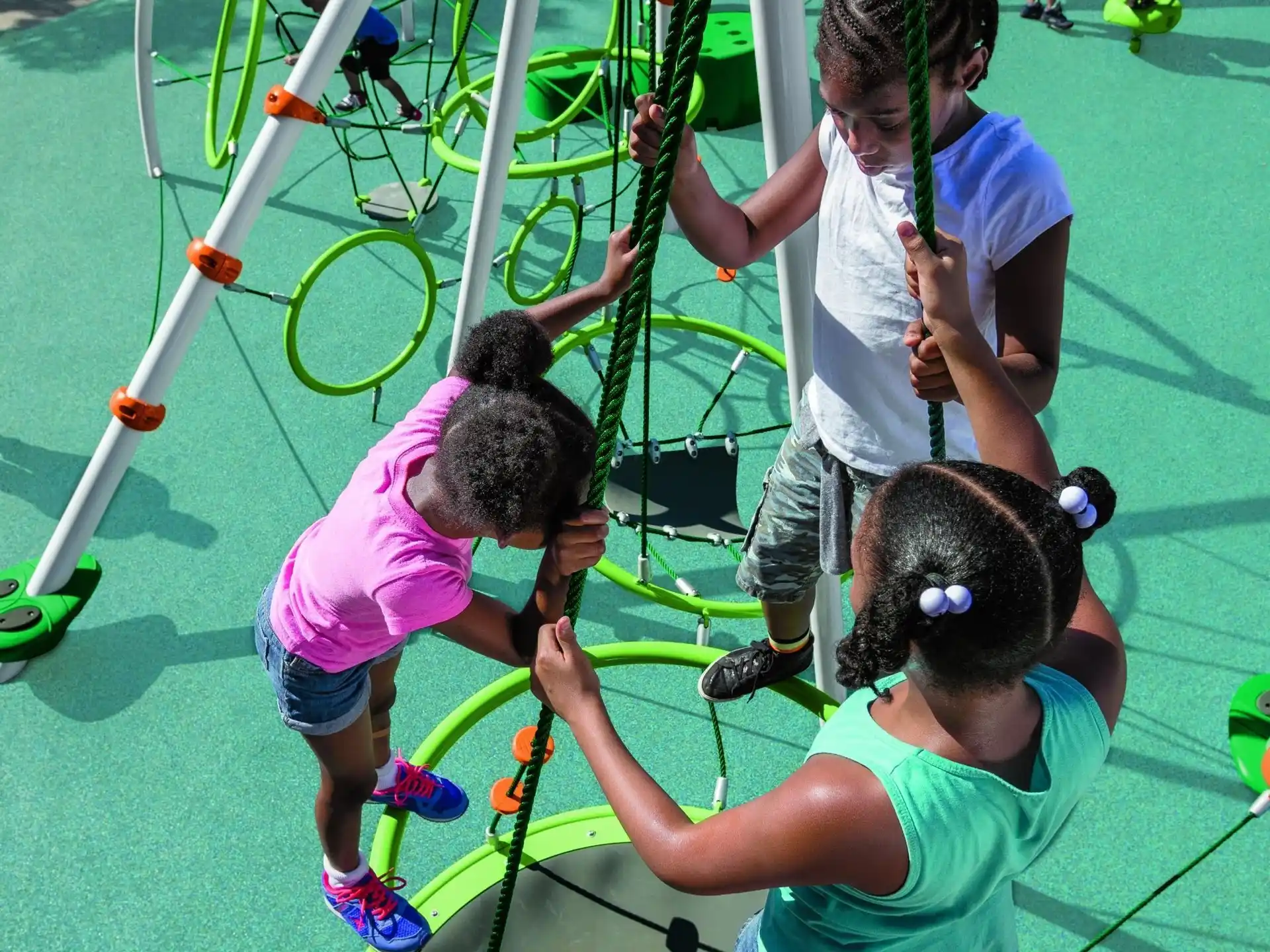 a group of children playing on a playground