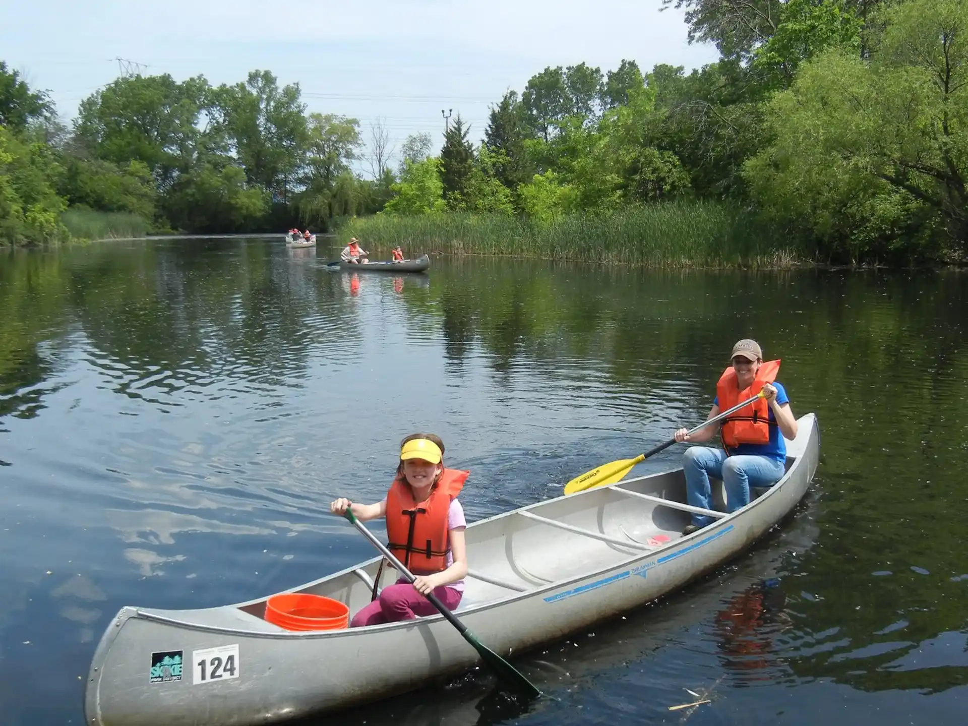 a couple of people in a canoe on a river