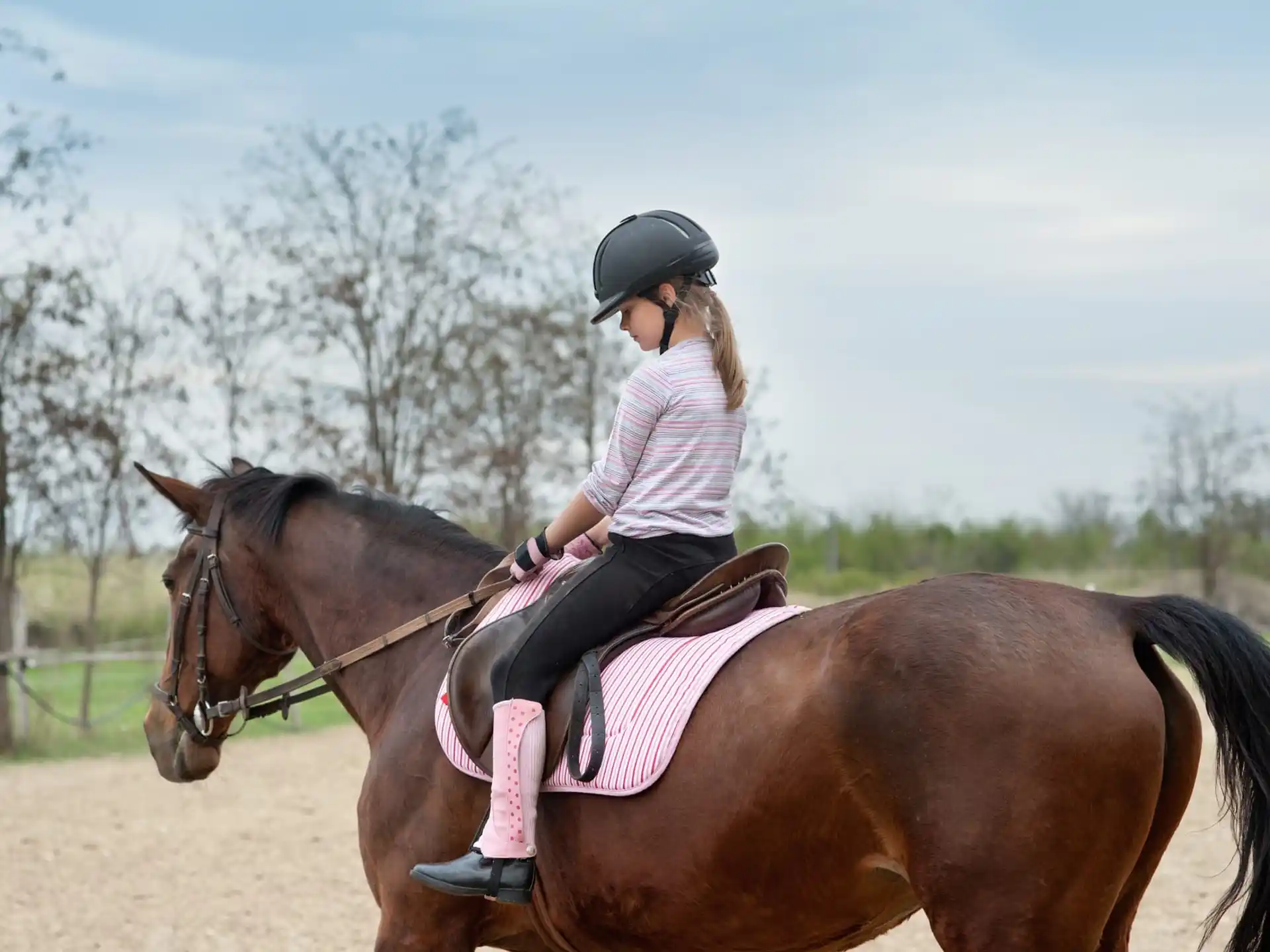 a girl riding a horse