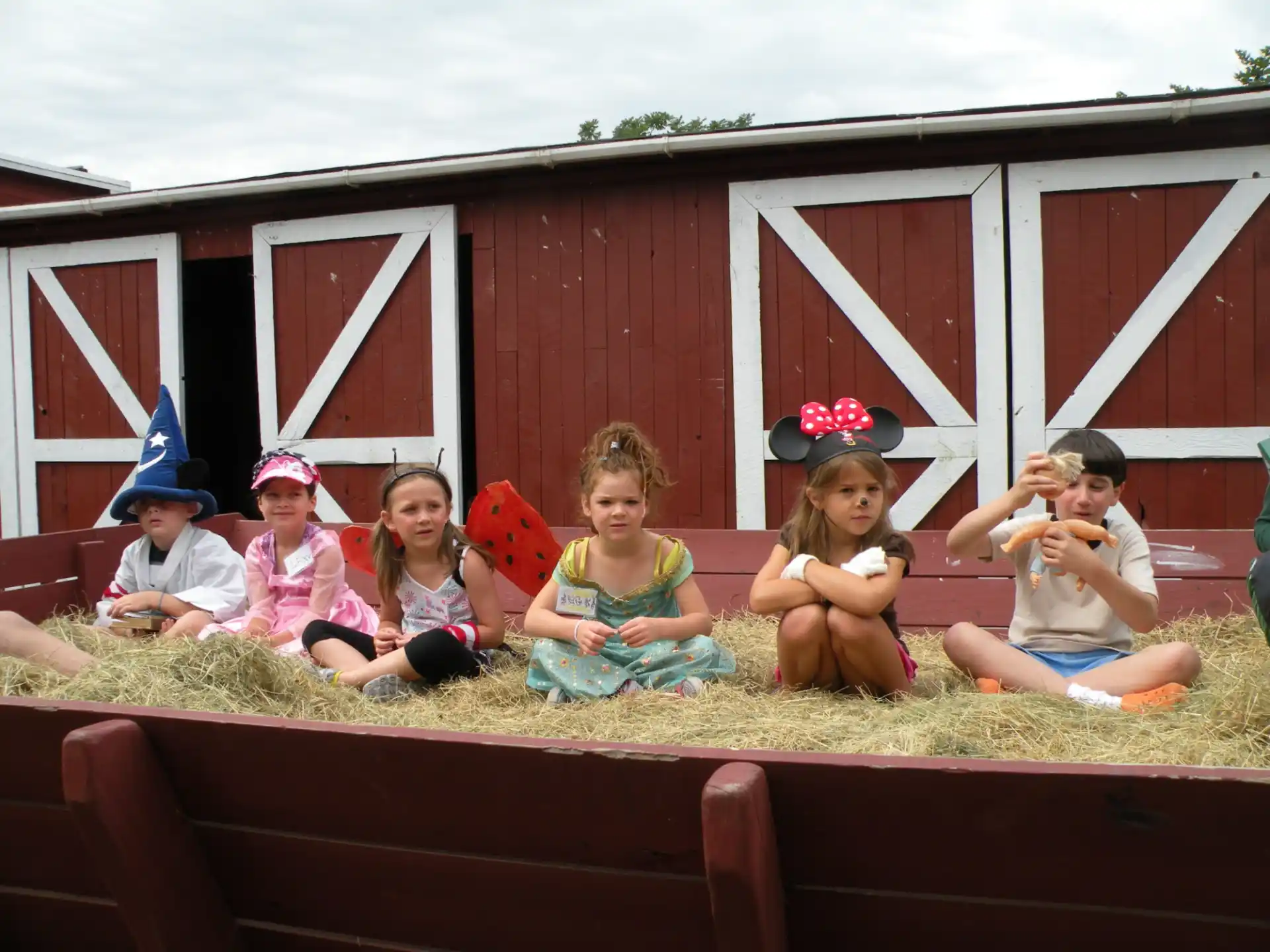 a group of children wearing party hats