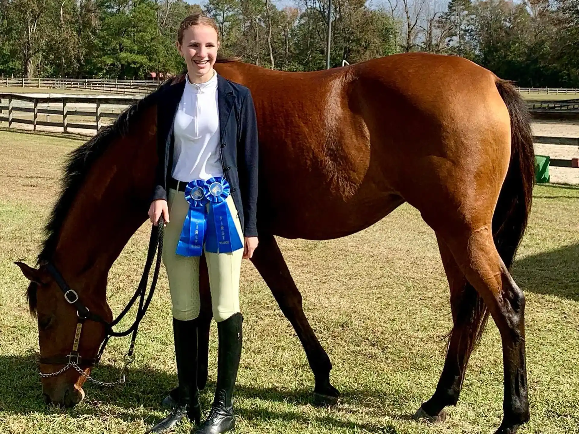 a person standing next to a horse