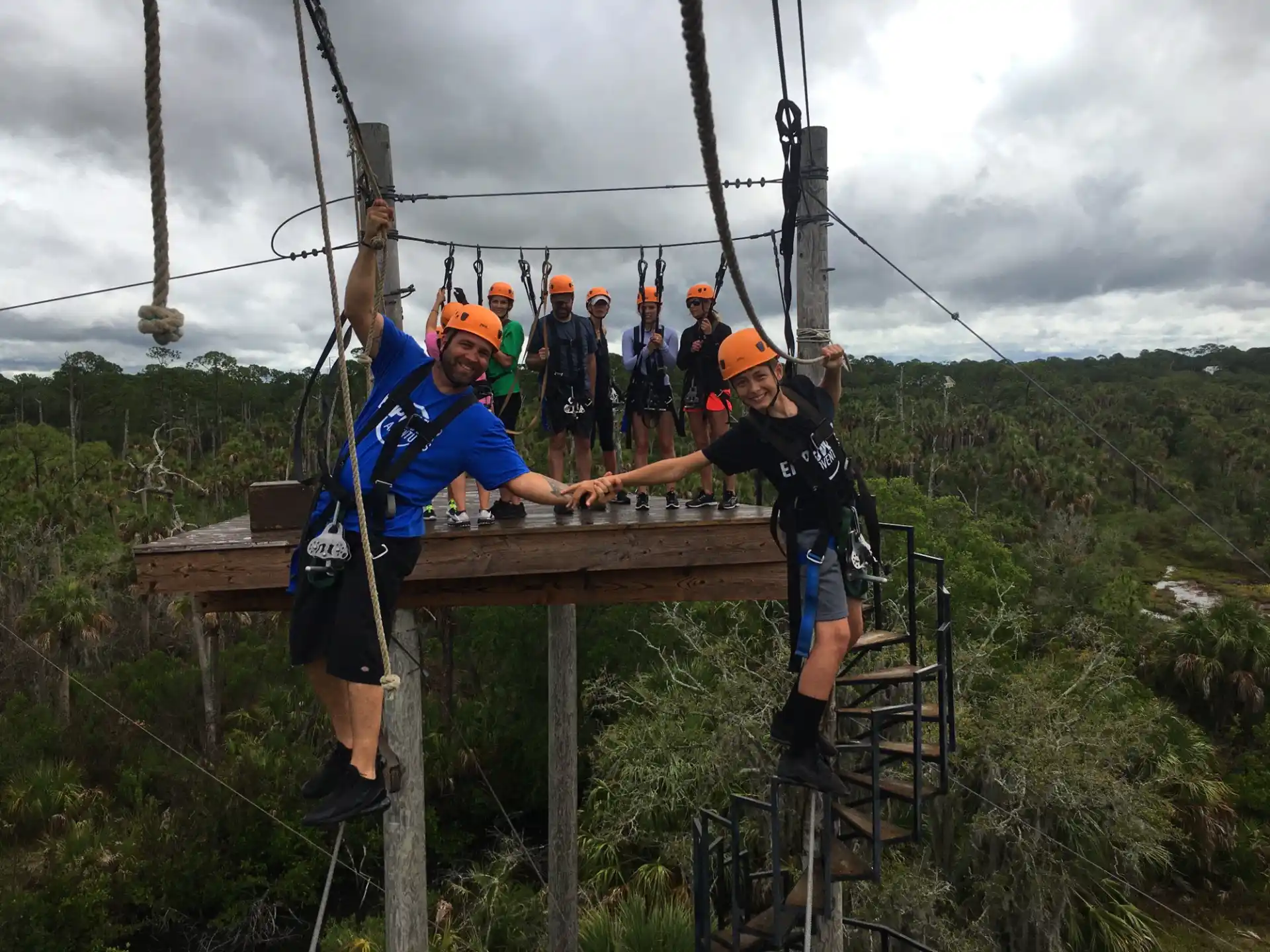 a group of people on a wooden platform