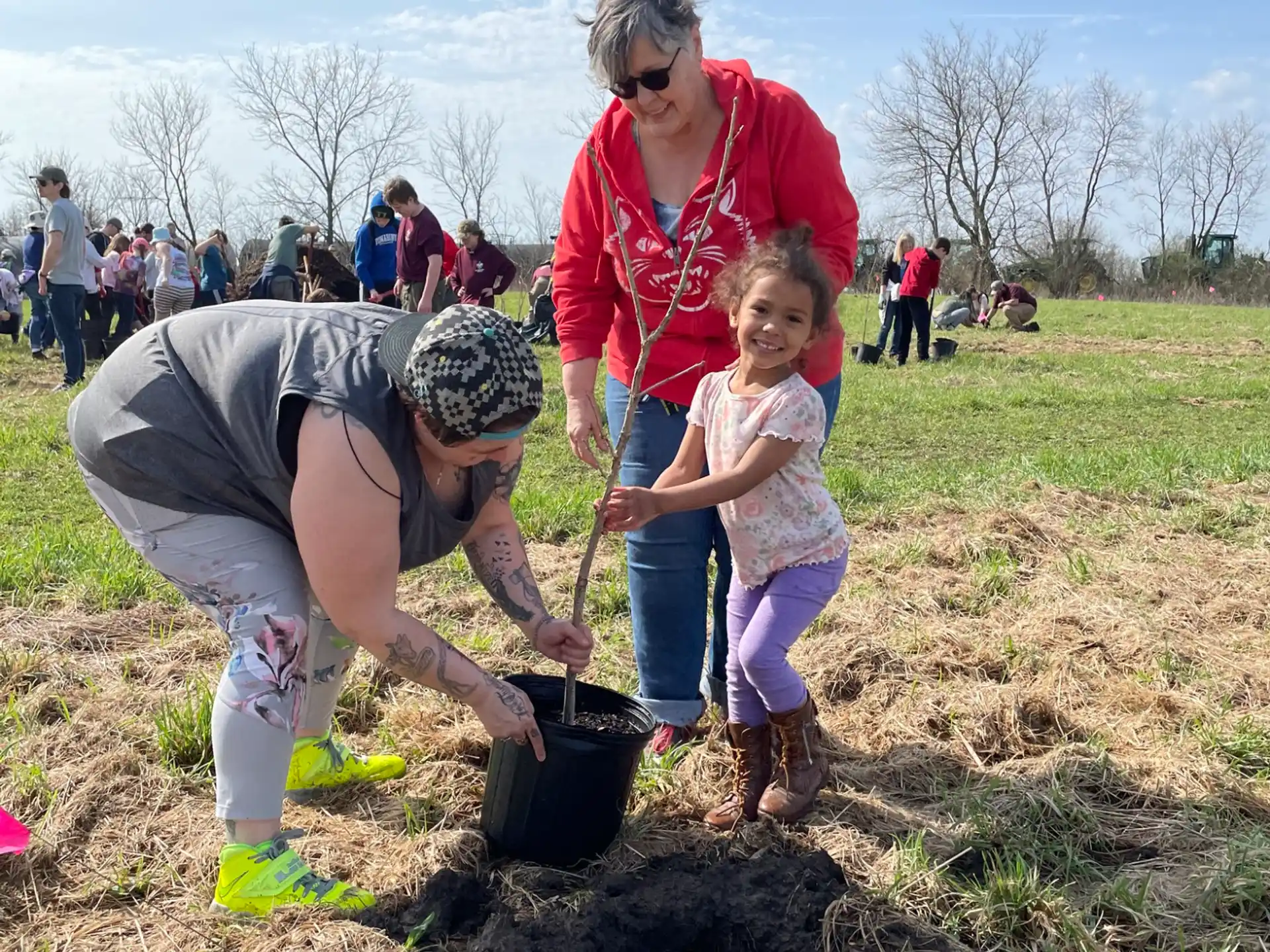 a man and a child digging in the dirt