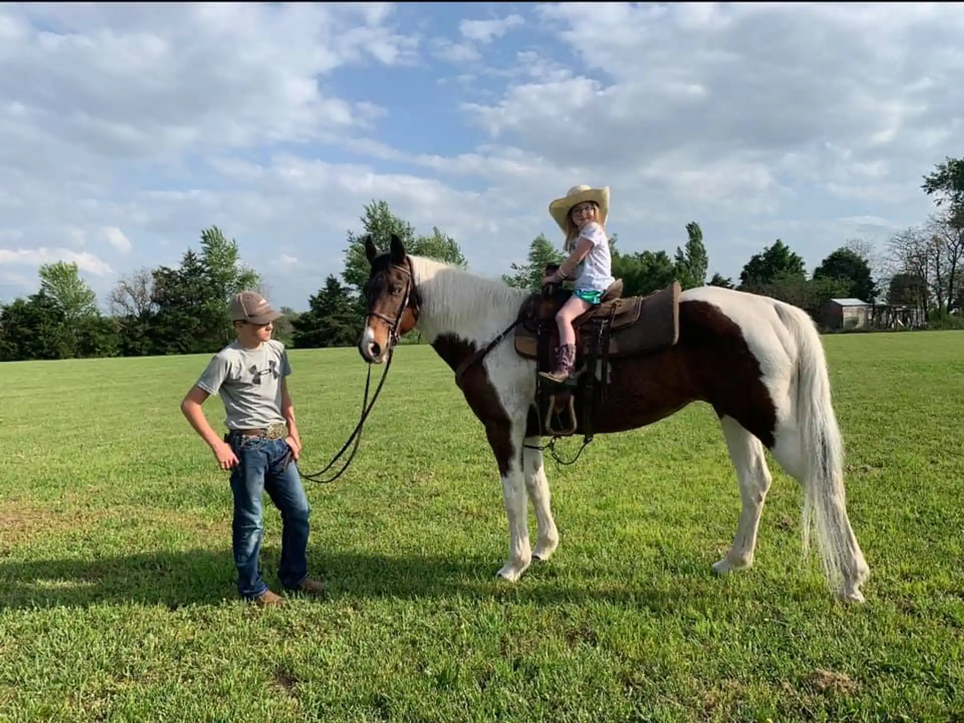 a person and a girl on a horse