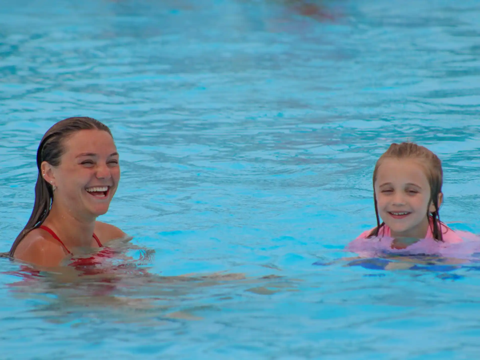 a woman and a child in the water