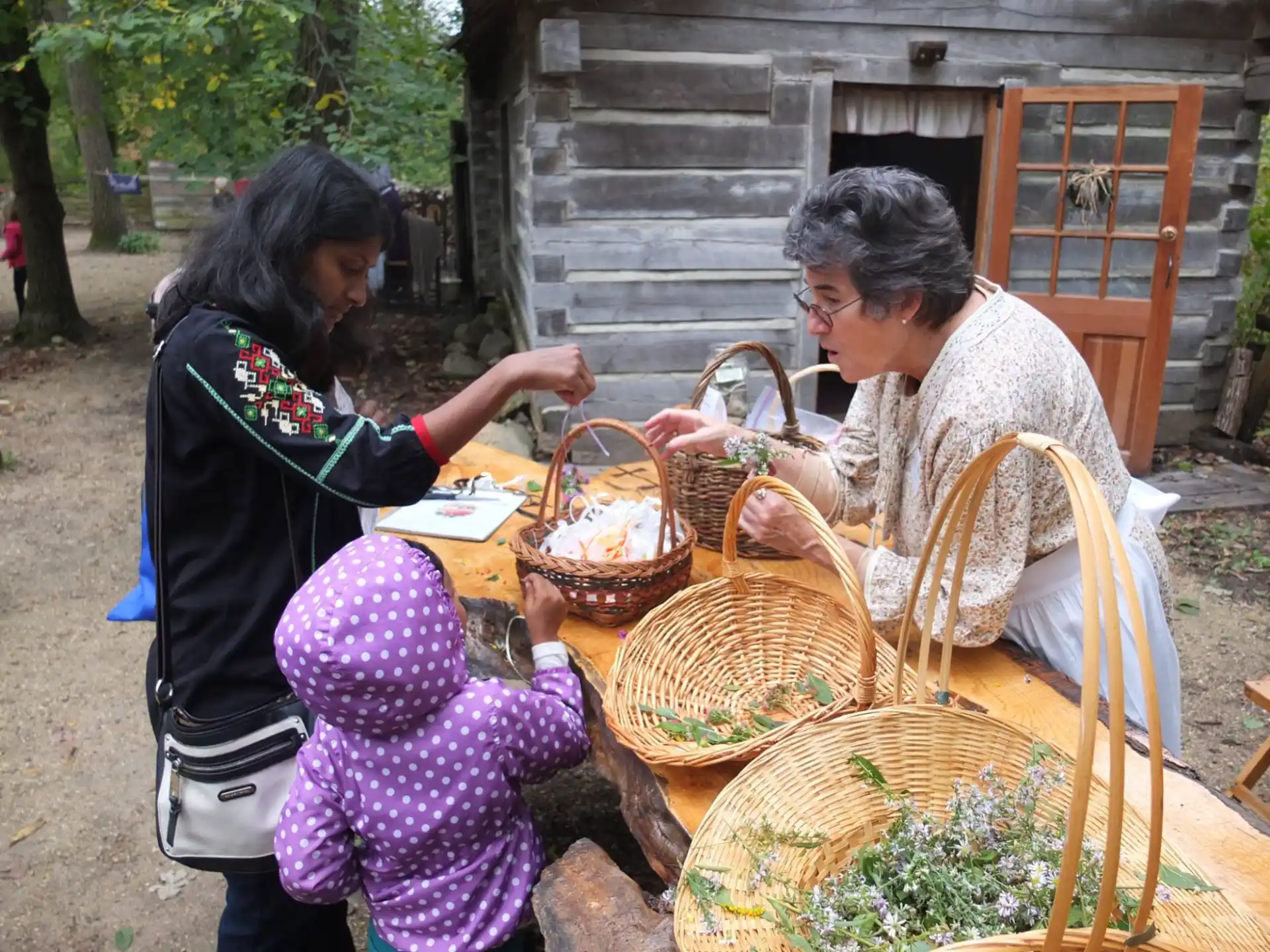 a woman and a child sitting outside