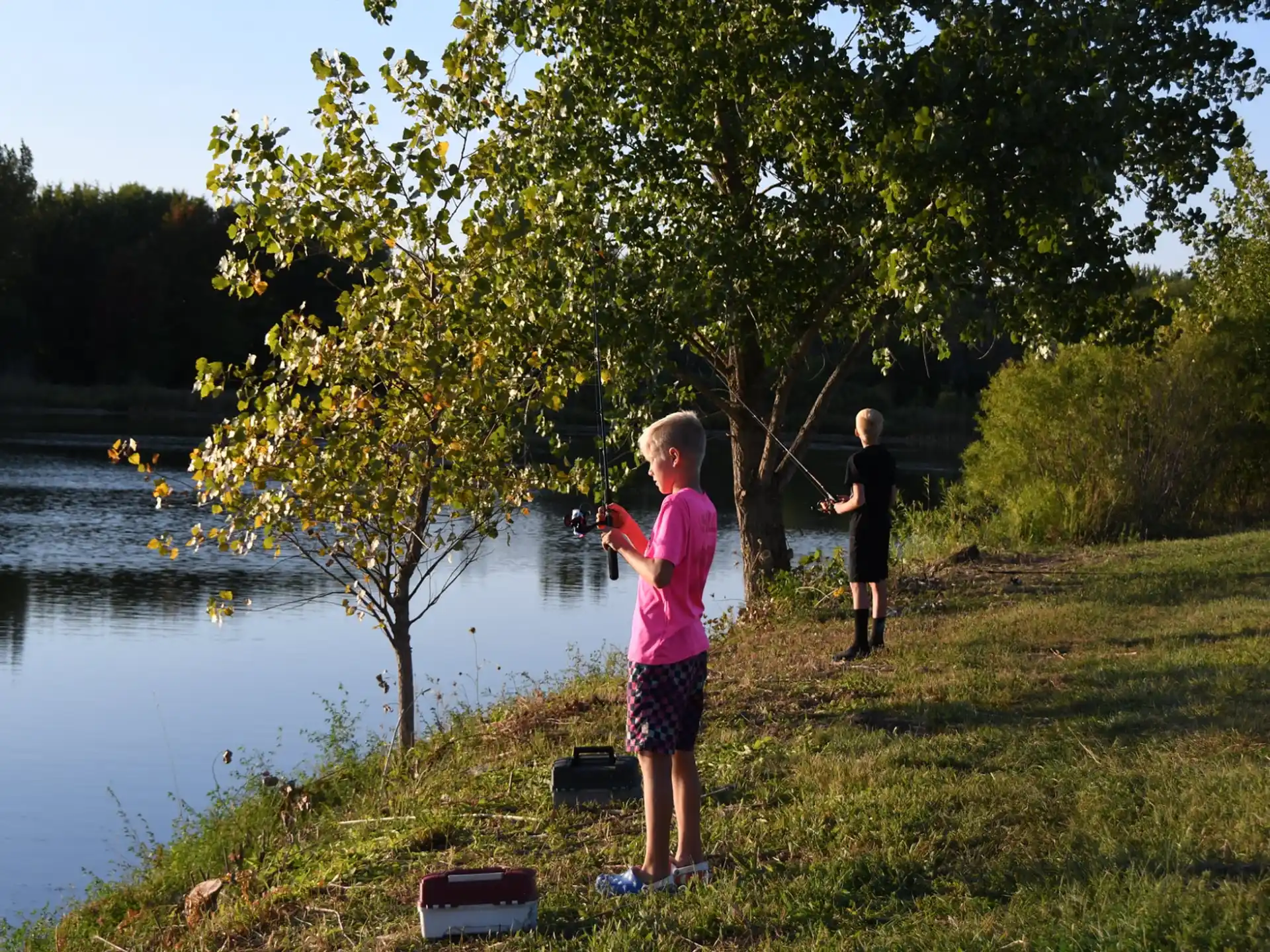 a couple of boys fishing