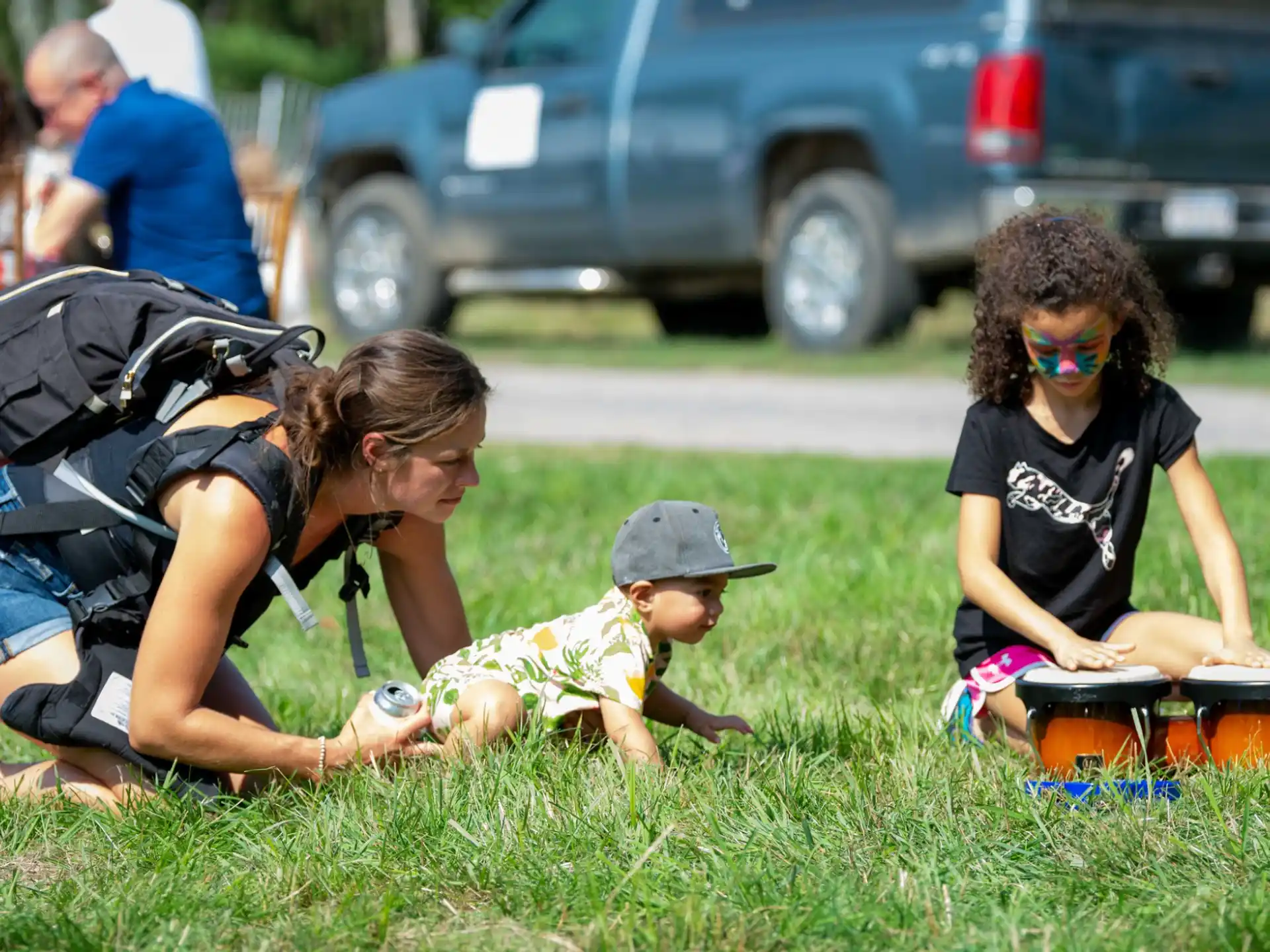 a person and a child playing with a toy truck