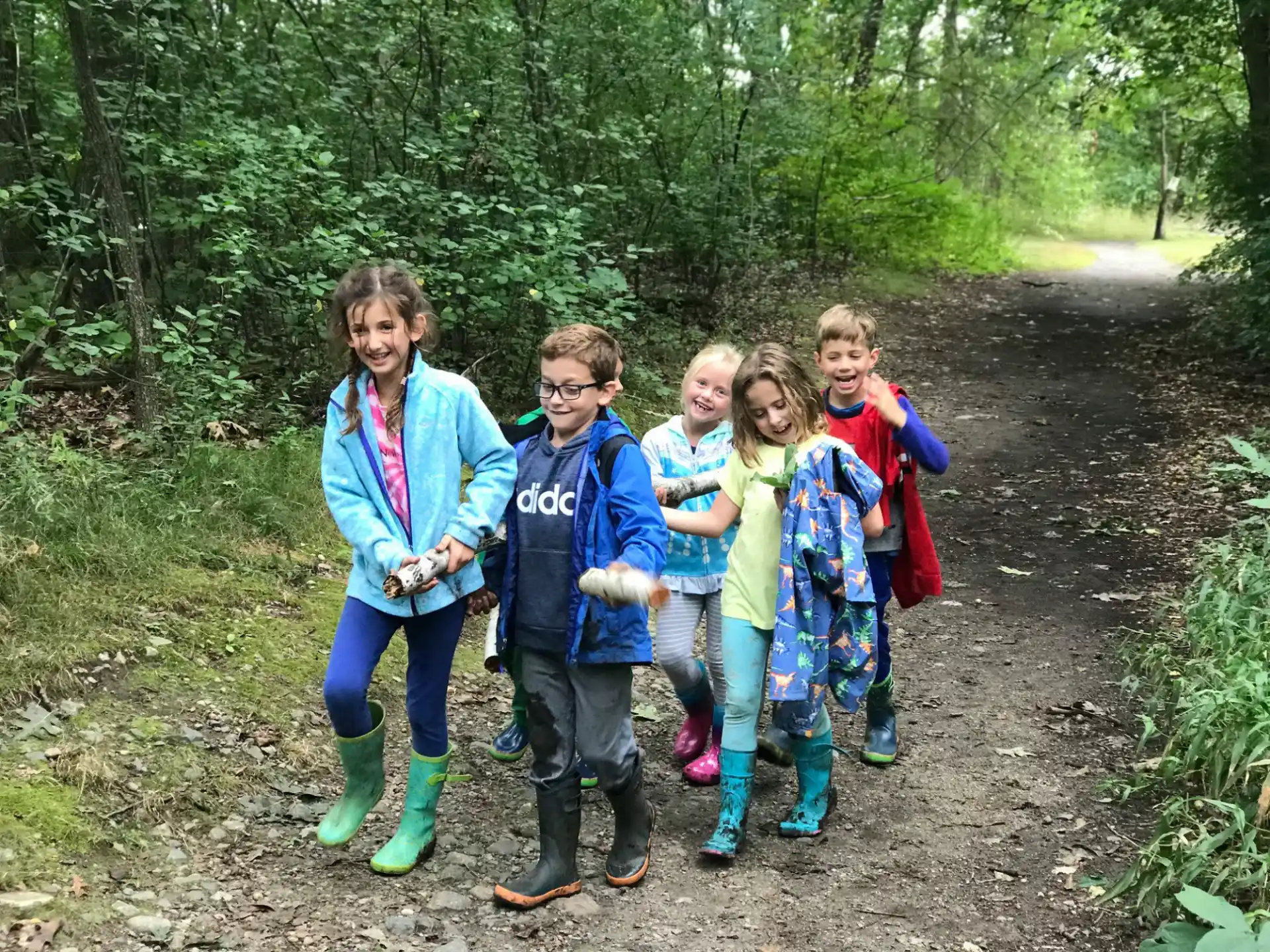 a group of people posing for a photo in the woods
