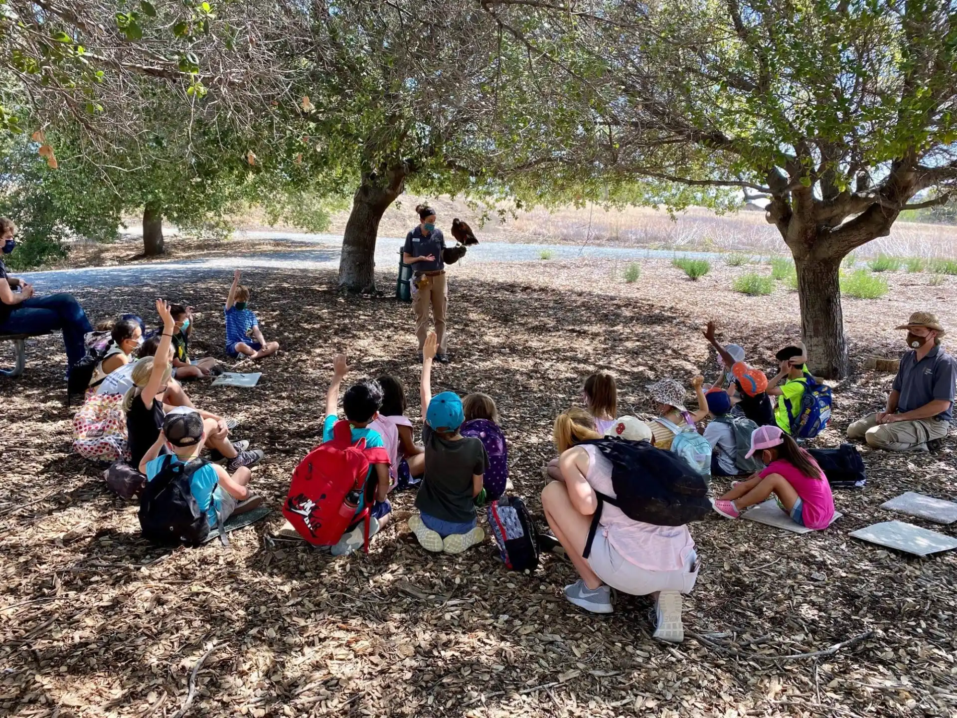 a group of people sitting on the ground