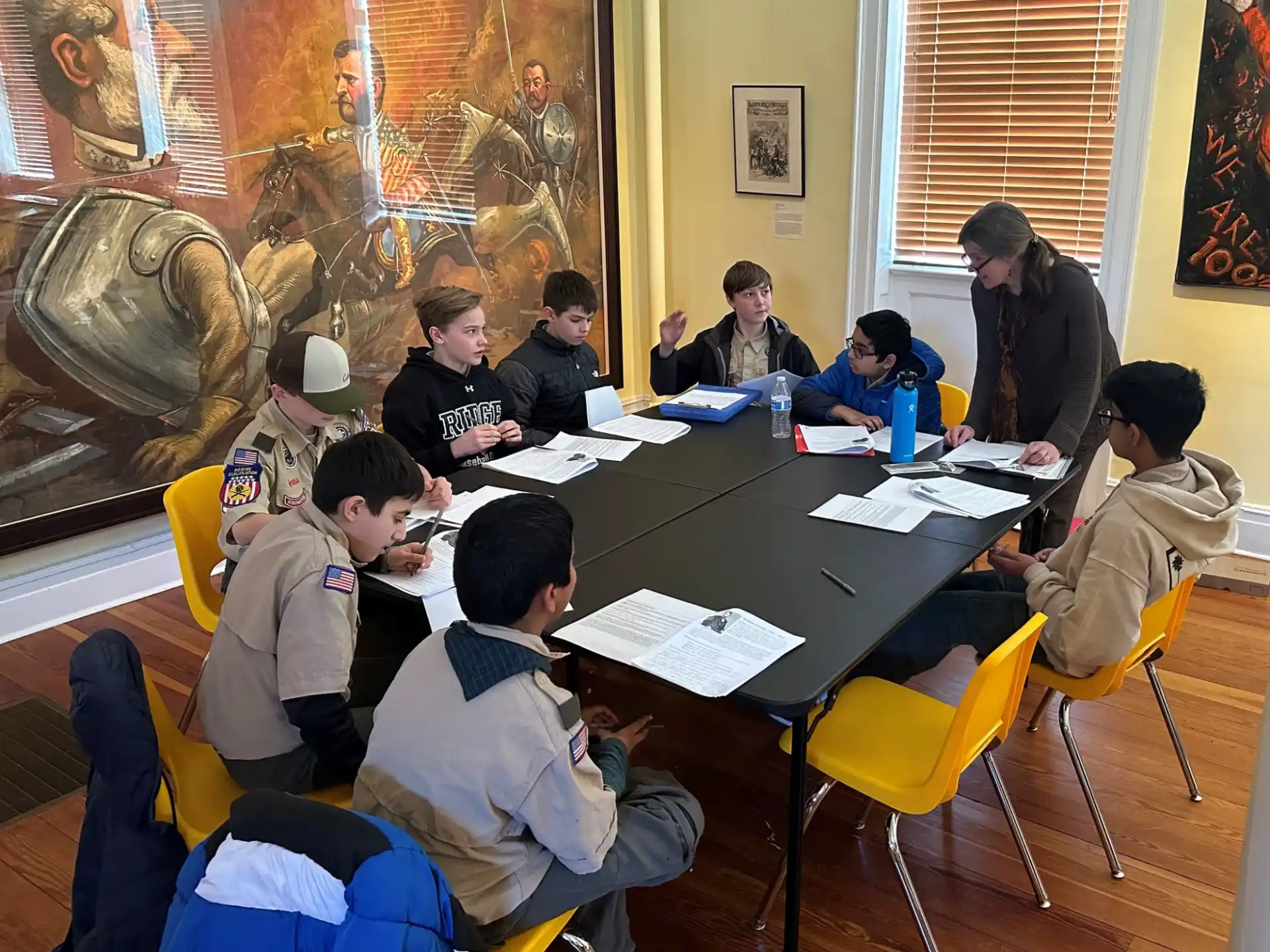 a group of people sitting around a table