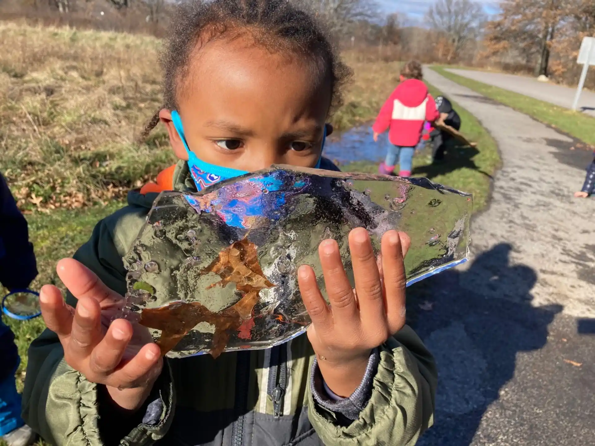 a boy holding a turtle