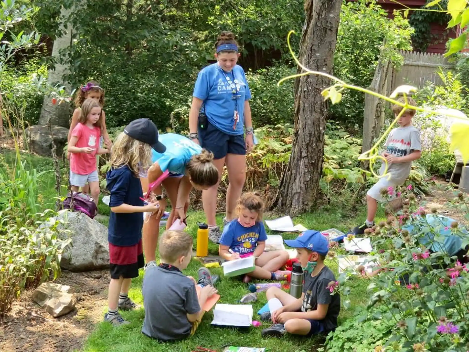 a group of children in a garden