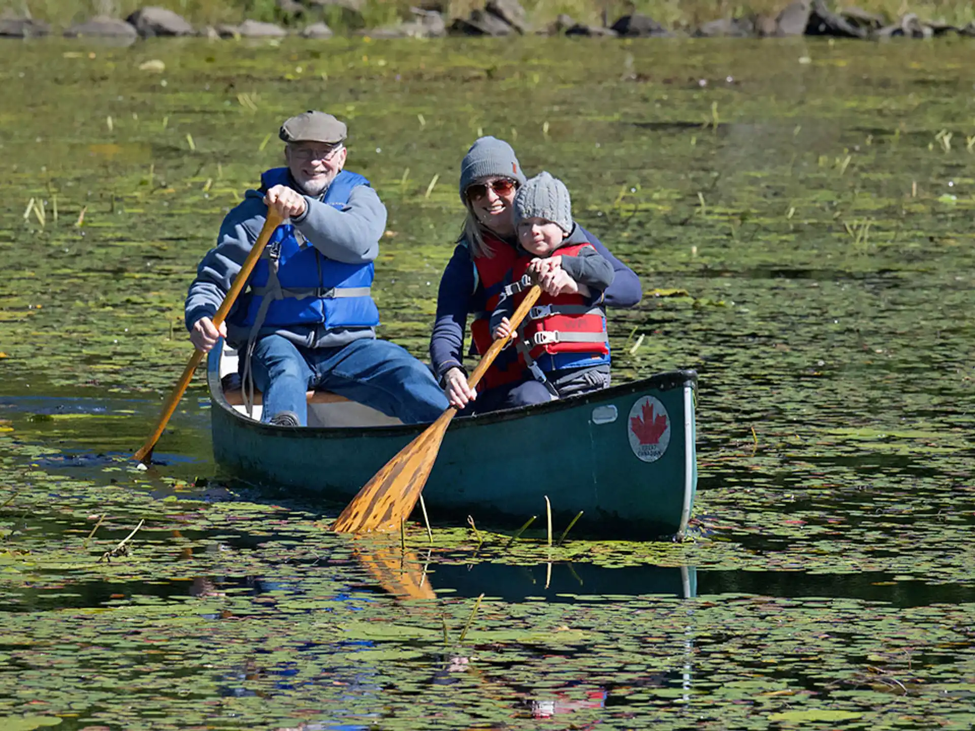 a group of people in a canoe