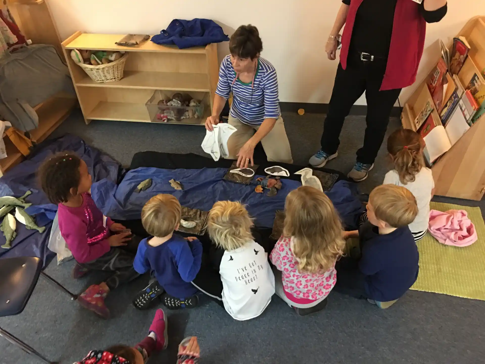 a group of children sitting on the floor