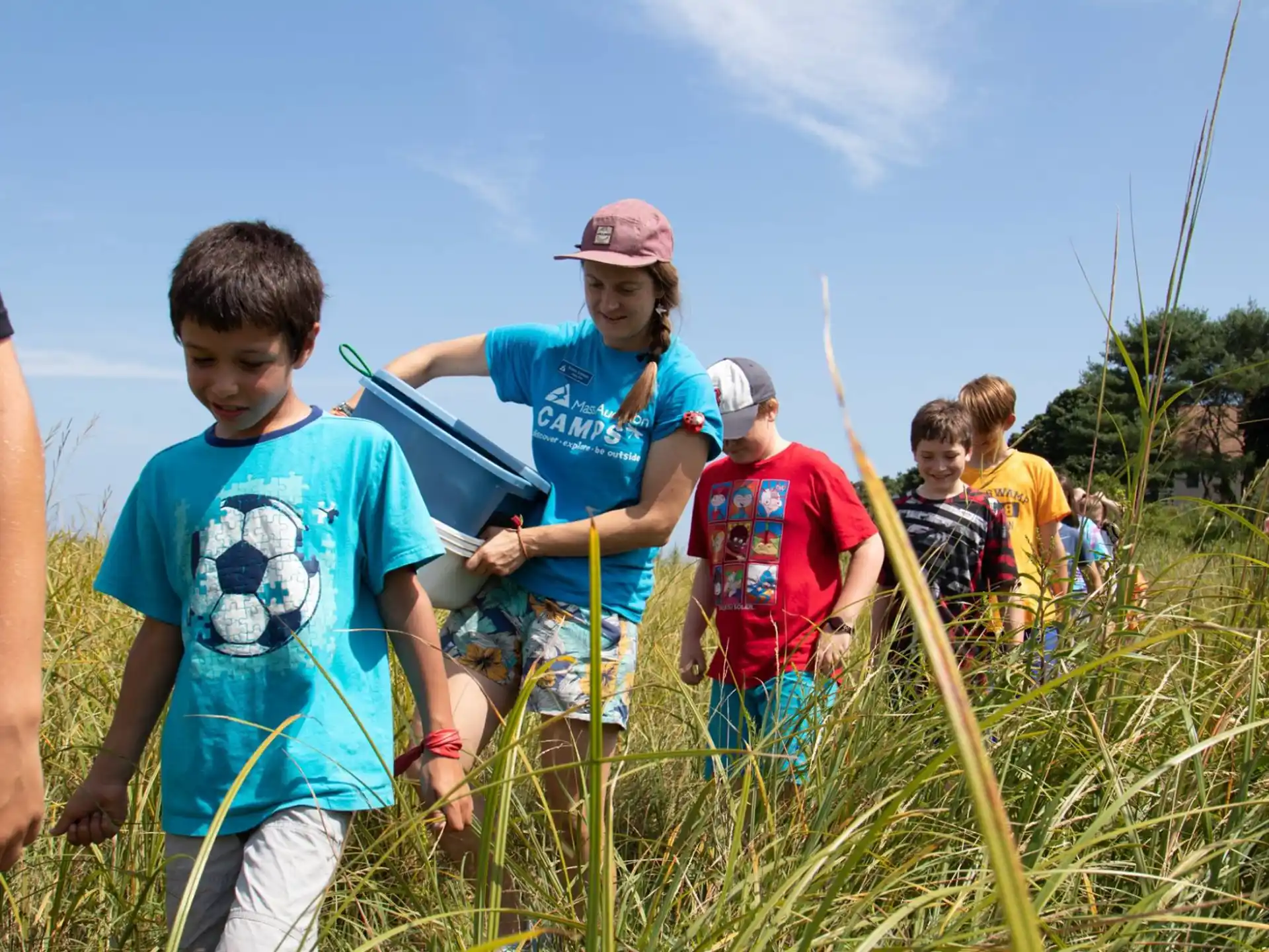 a group of kids in a field