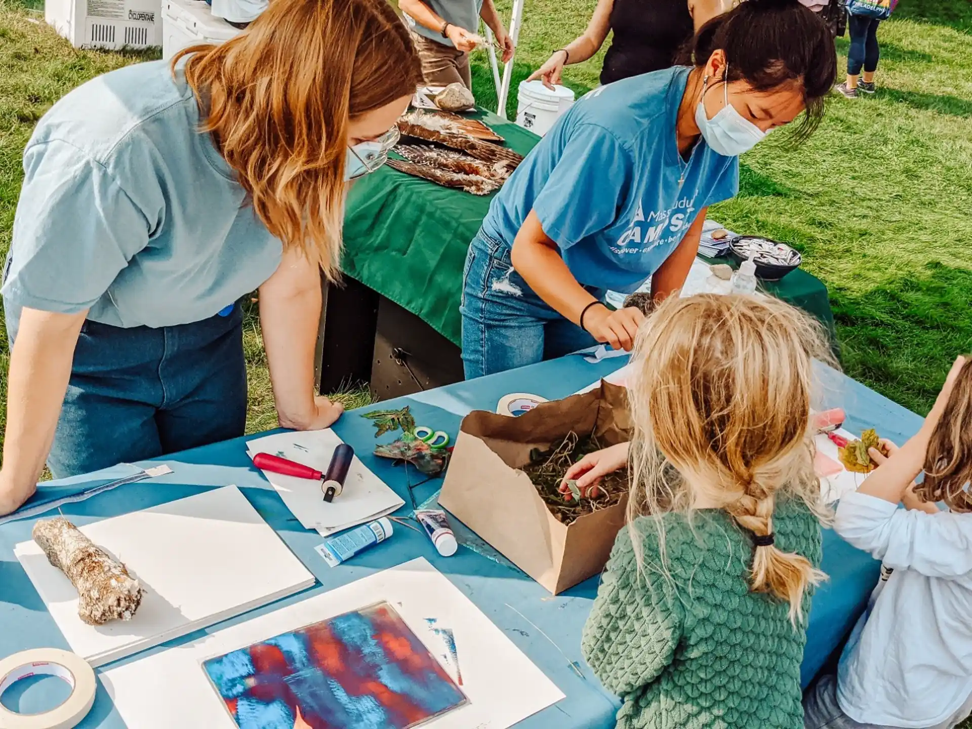 a group of people painting on a table