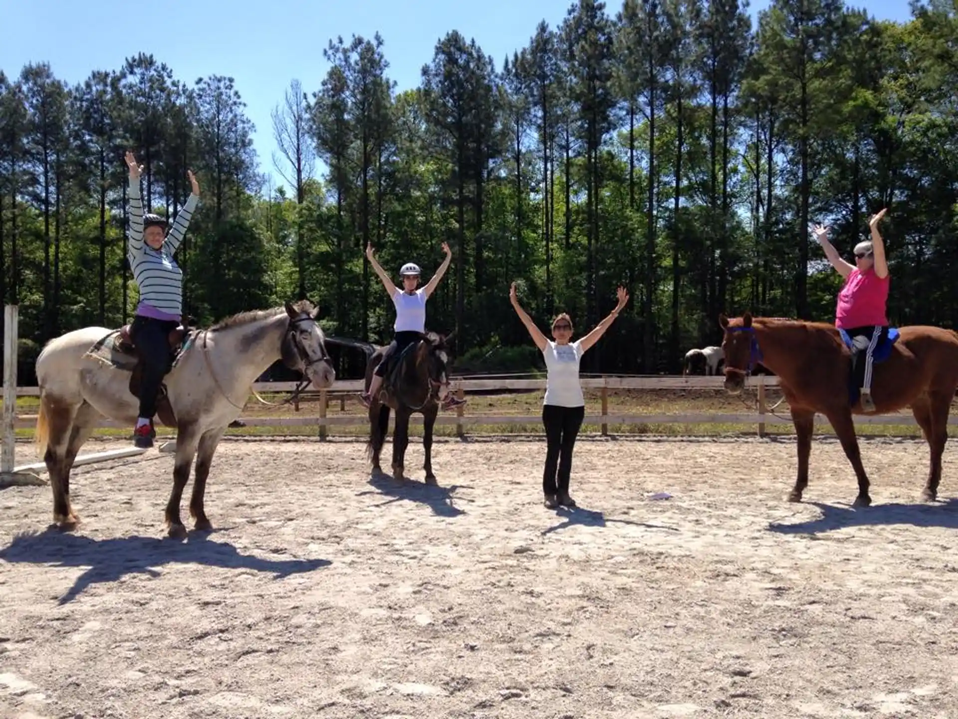 a group of people riding horses