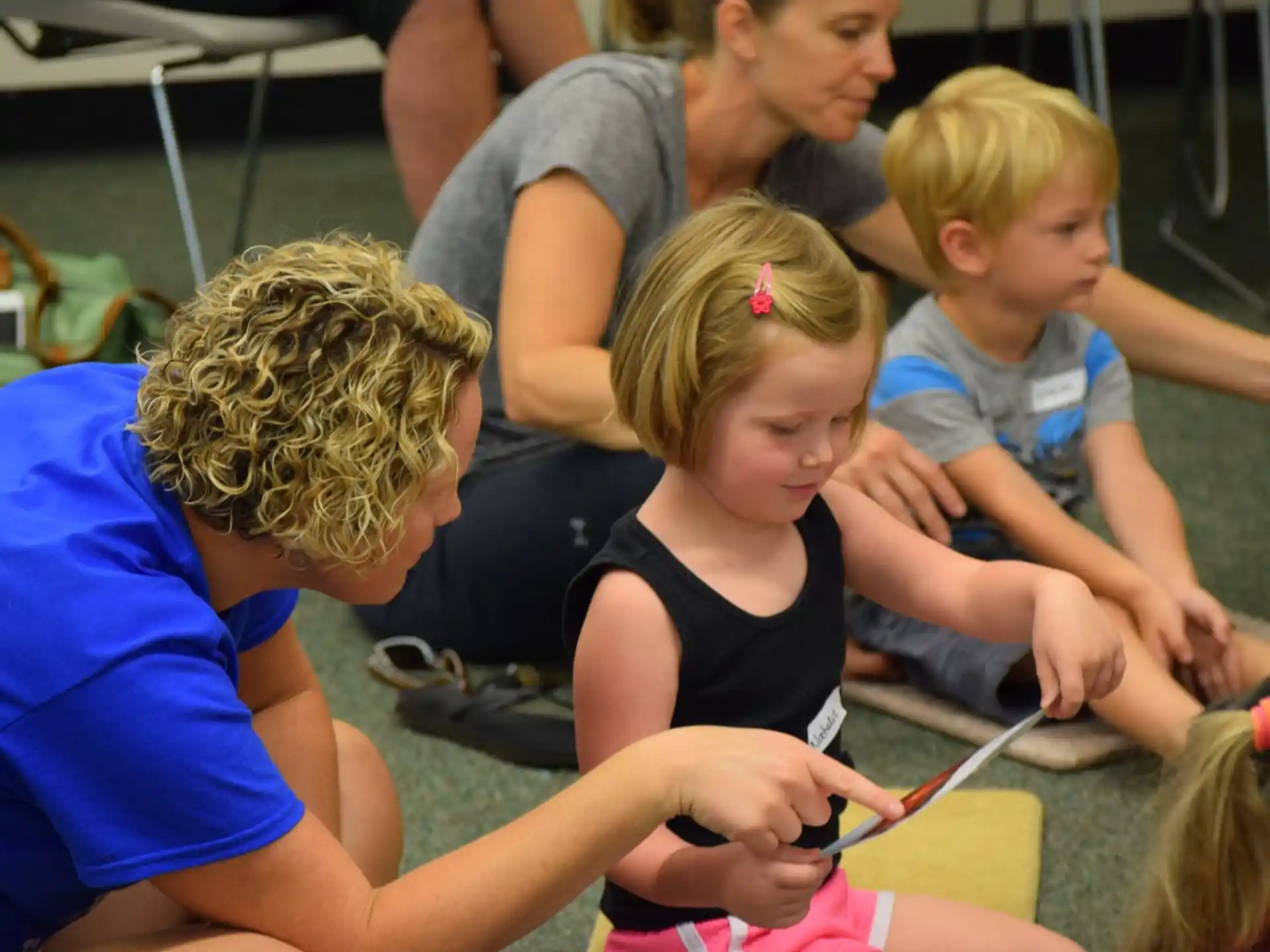 a group of children playing with a toy