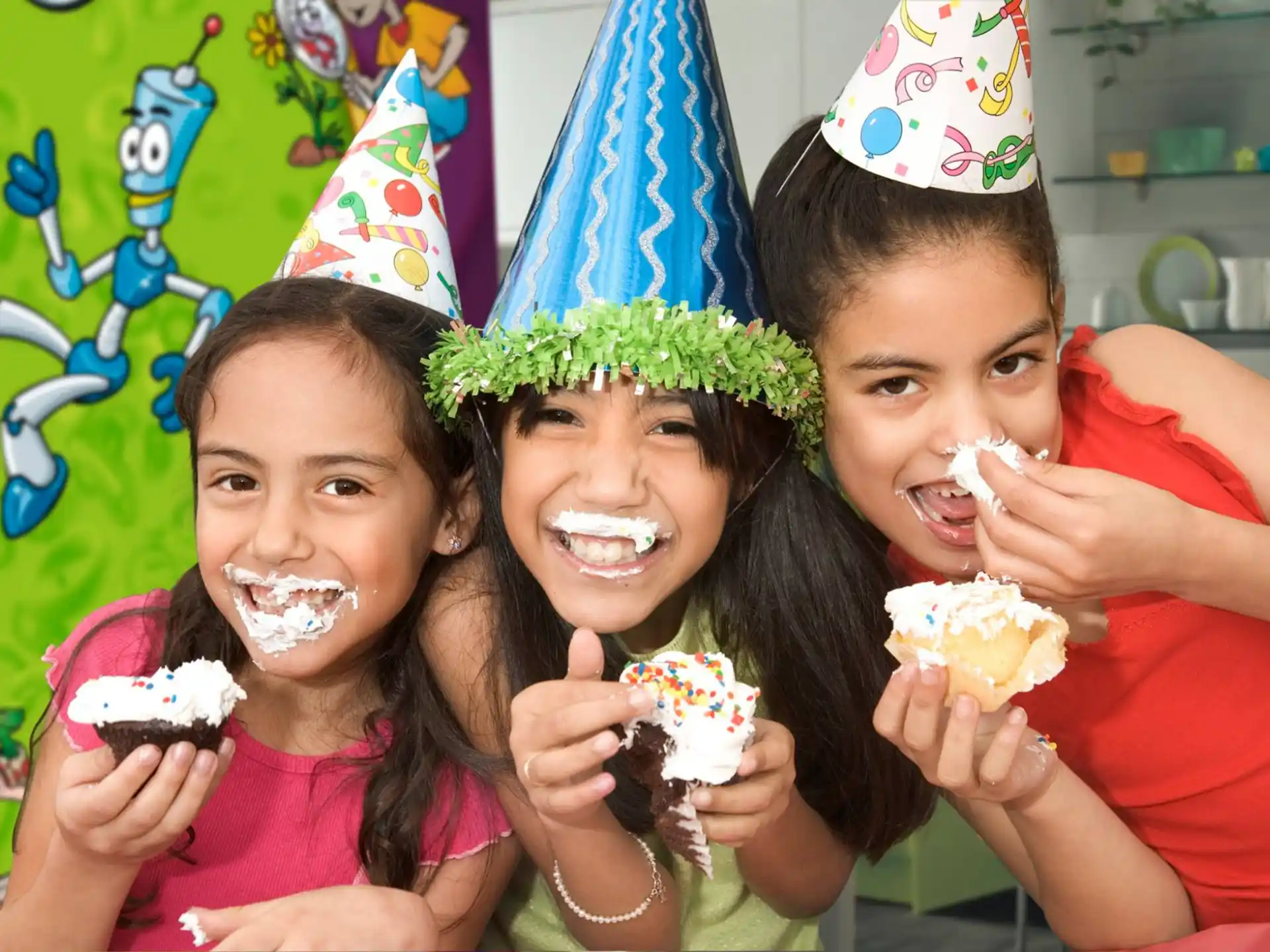 a group of girls with cupcakes in their hands