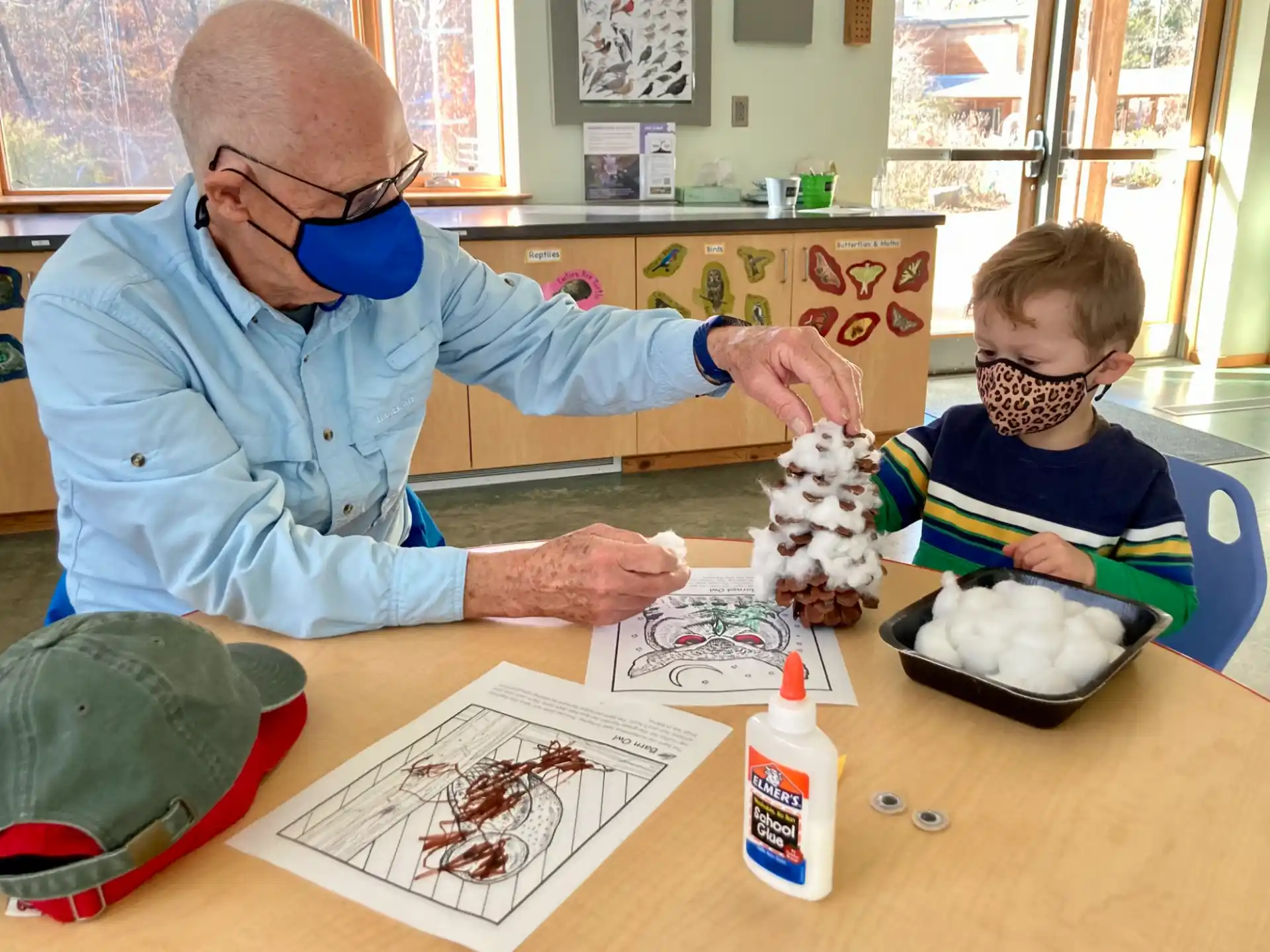 a person and a boy painting