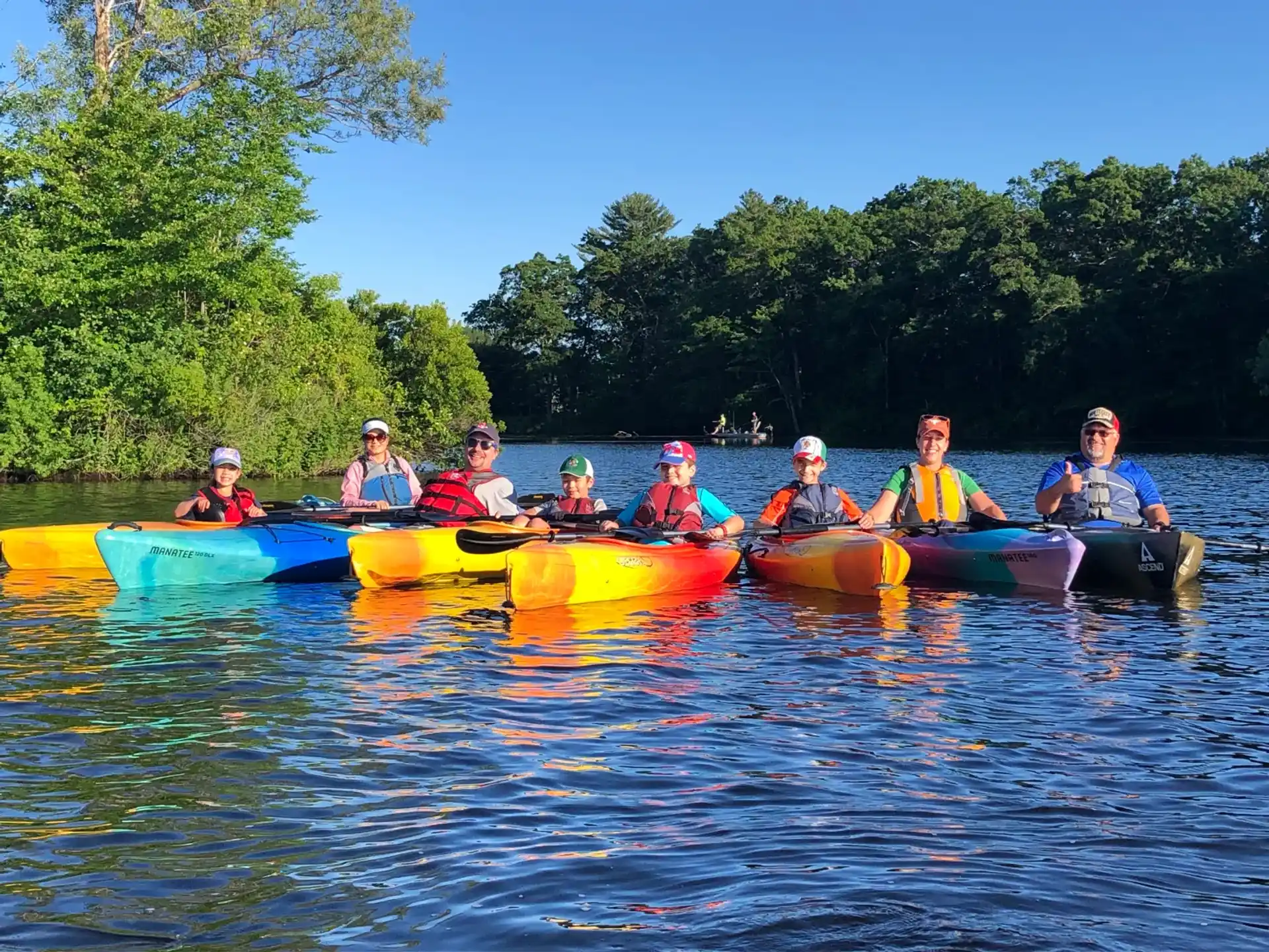 a group of people in canoes on a lake