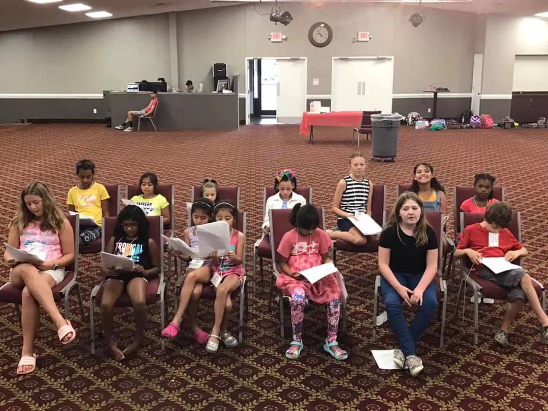 a group of people sitting in chairs