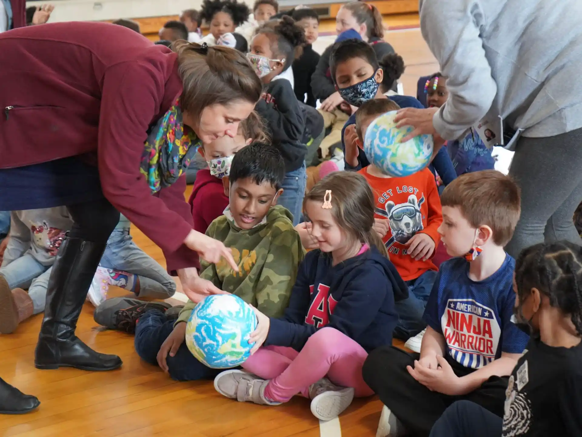 a group of children sitting on the floor