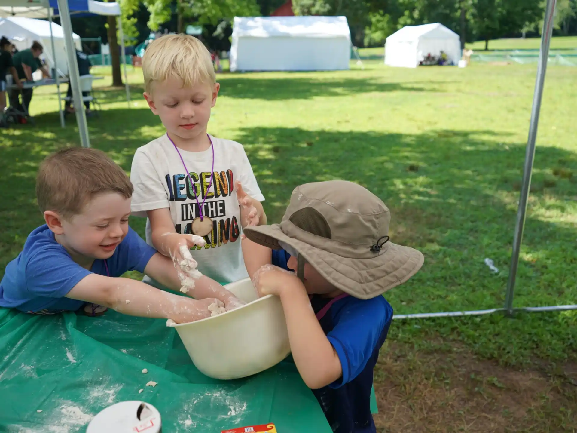 a group of kids playing in a bucket